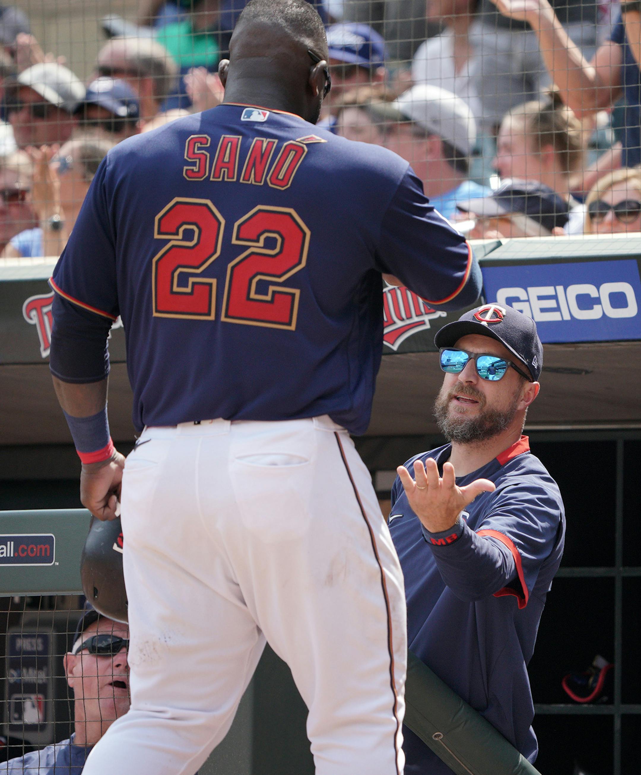 Twins Miguel Sano hit a two RBI double in the 5th inning to tie the game. Here getting a hand from manager Rocco Baldelli anfter scoring on a Gordon double to go ahead 6 to 5.