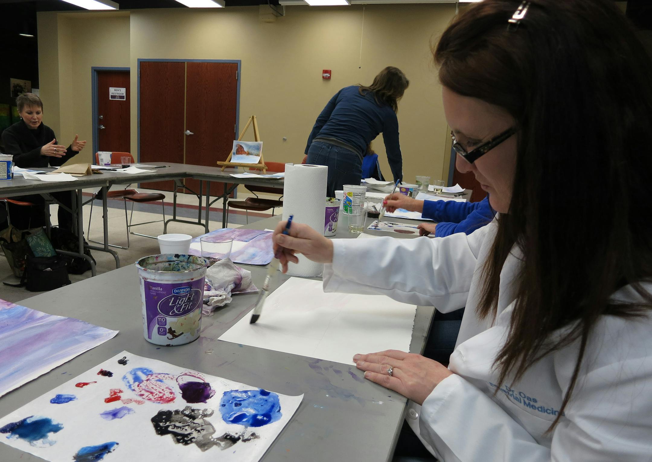 Courtesy of Lakeville Area Arts Center Kristina Murto of Lakeville worked on a watercolor painting at a Wine & Designs workshop at the Lakeville Area Arts Center this spring.