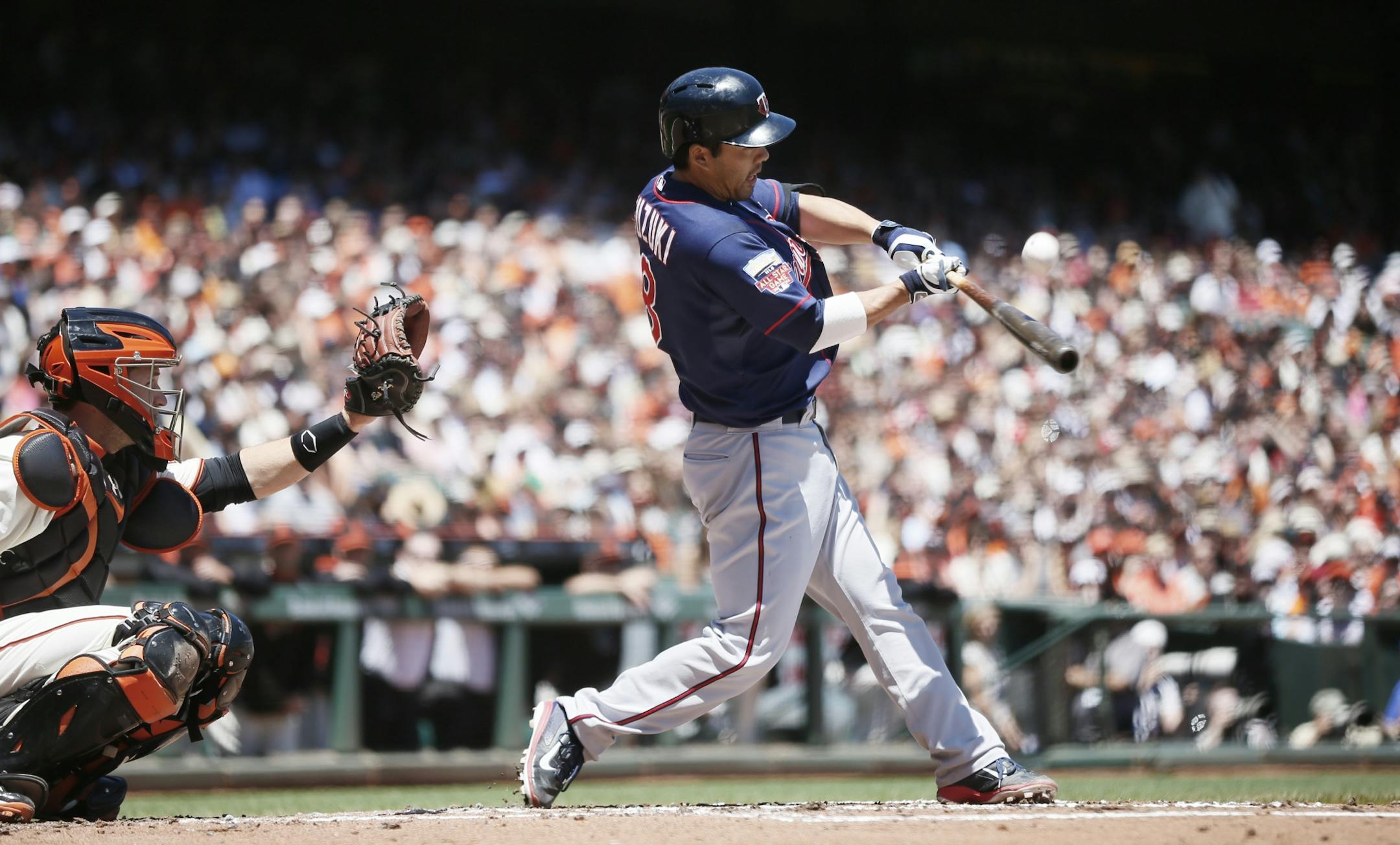 Minnesota Twins catcher Kurt Suzuki (8) hit a fly ball in the infield for an out during MLB action at AT&T Park between the Minnesota Twins and Giants May 25, 2014 in San Francisco , CA.