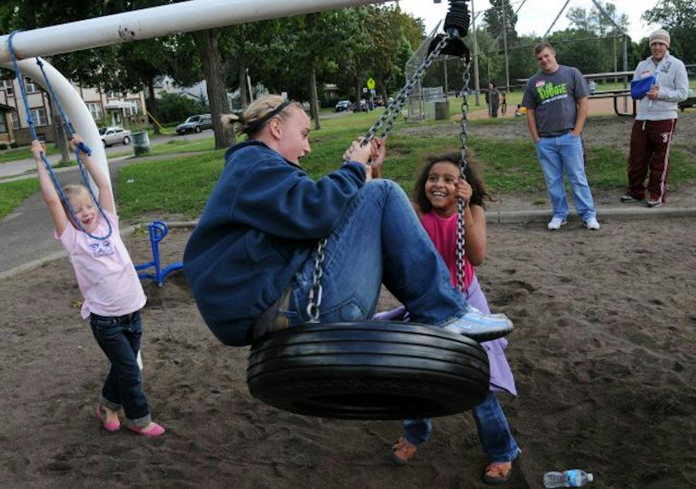 At Matthews Community Center, Rachel Nelson was pushed on a tire swing by Quinn Williams, 8. Lucea DeFlorin, 6, is at left.