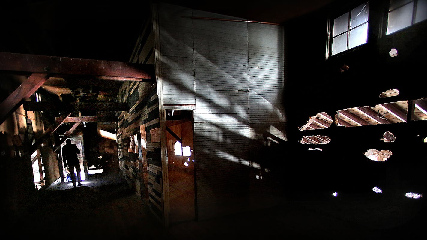 Andrew Michaelson, Senior Housing Development Manager with CommonBond Communities, used a flashlight to examine the second floor at Building #211.] JIM GEHRZ&#xa5;jgehrz@startribune.com (JIM GEHRZ/STAR TRIBUNE) / March 7, 2013 / 2:30 PM Minneapolis, MN- BACKGROUND INFORMATION: A new plan will resurrect the 100-year-old officers' building and the stables at Fort Snelling to housing for homeless veterans.