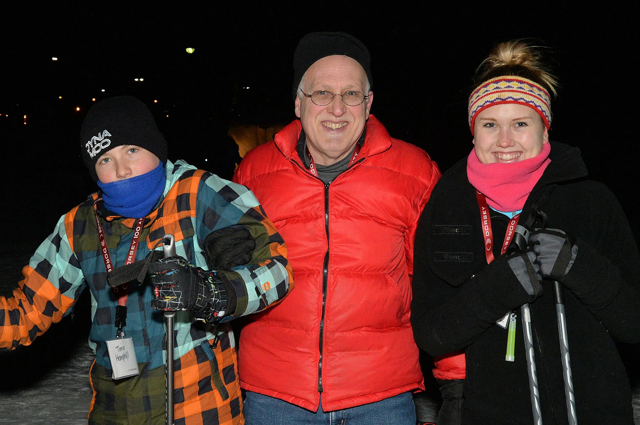 Stuart Hemphill (center) repairs a problematic ski on Lake Calhoun with his kids Timo and Hayley. ] (SPECIAL TO THE STAR TRIBUNE/BRE McGEE) **Timo Hemphill (left), Stuart Hemphill (center, dad), Hayley Hemphill (right)