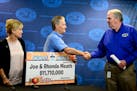Minnesota Lottery director Ed Van Petten, right, presented Bethel couple Joe and Rhonda Meath as multi-million dollar lotto winners in September.