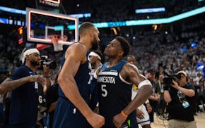 The Timberwolves' Anthony Edwards (5) and Rudy Gobert congratulate each other after Wednesday's victory.