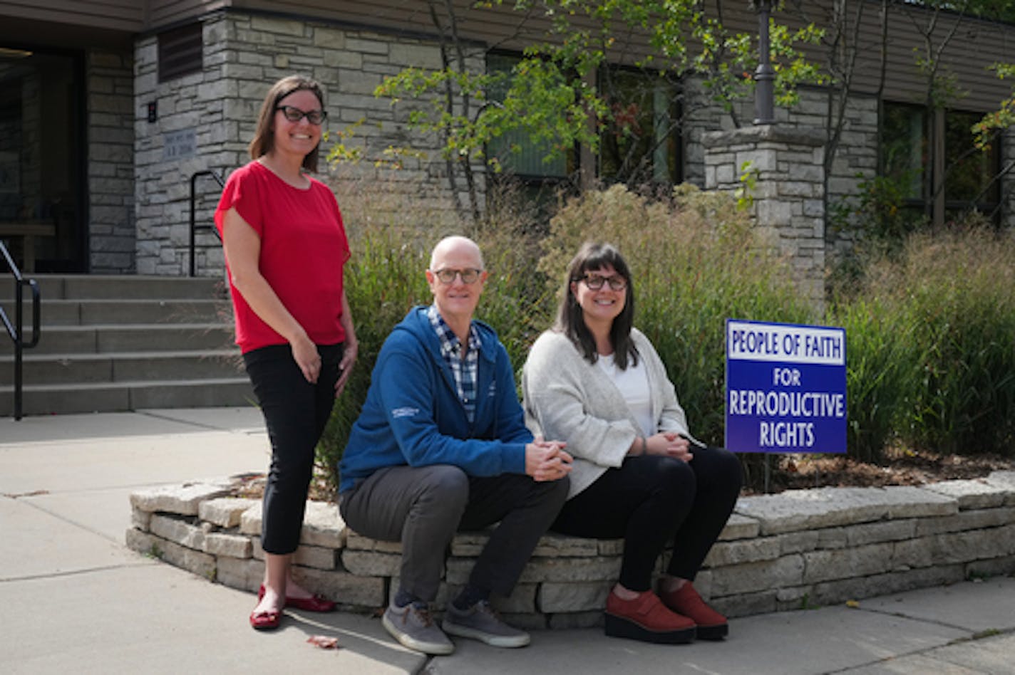 From left, Deacon Lauren Morse-Wendt, Pastor Jeff Sartain and Pastor Anna Helgen stand outside Edina Community Lutheran Church with a sign that reads 'People of Faith for Reproductive Rights,' Wednesday, Sept. 21, 2022 in Edina, Minn. In the months since the Supreme Court overturned Roe v. Wade, a number of Twin Cities faith communities have begun publicly supporting abortion rights, some in new and very visible ways — from a Lutheran church's lawn signs that say "People of faith for reproductive rights" to bumper stickers from the Minnesota chapter of the National Council of Jewish Women reading "Abortion bans are against my religion." ] SHARI L. GROSS / shari.gross@startribune.com