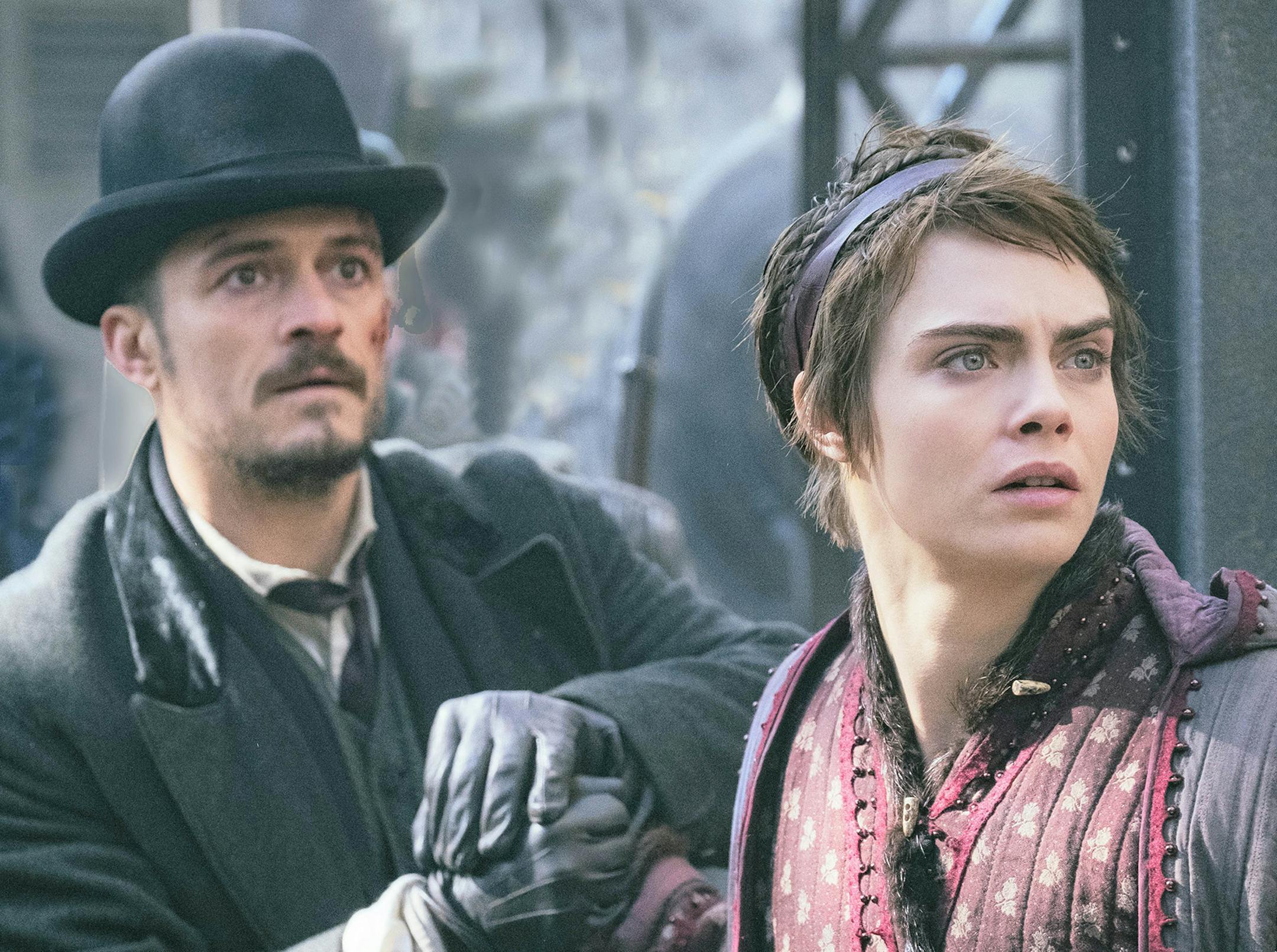 Orlando Bloom (left) and Cara Delevingne costar in Amazon's Victorian fantasy "Carnival Row," premiering Friday. (Jan Thijs/Handout/TNS) ORG XMIT: 1404289