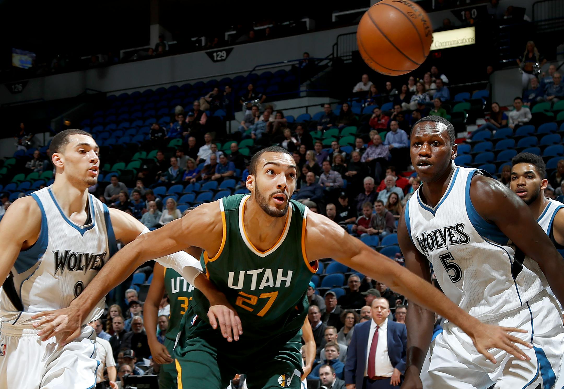 The Wolves' Zach LaVine (8) and Gorgui Dieng (5) battled the Jazz's Rudy Gobert (27) for a loose ball in the first quarter Monday night. ] CARLOS GONZALEZ cgonzalez@startribune.com - November 28, 2016, Minneapolis, MN, Target Center, NBA, Minnesota Timberwolves vs. Utah Jazz
