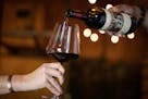 FILE -- A 1985 Martha&#x2019;s Vineyard cabernet sauvignon is poured into a wine glass at Heitz Cellar's Winery in St. Helena, Calif. on Aug. 26, 2019