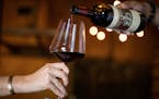 FILE -- A 1985 Martha&#x2019;s Vineyard cabernet sauvignon is poured into a wine glass at Heitz Cellar's Winery in St. Helena, Calif. on Aug. 26, 2019