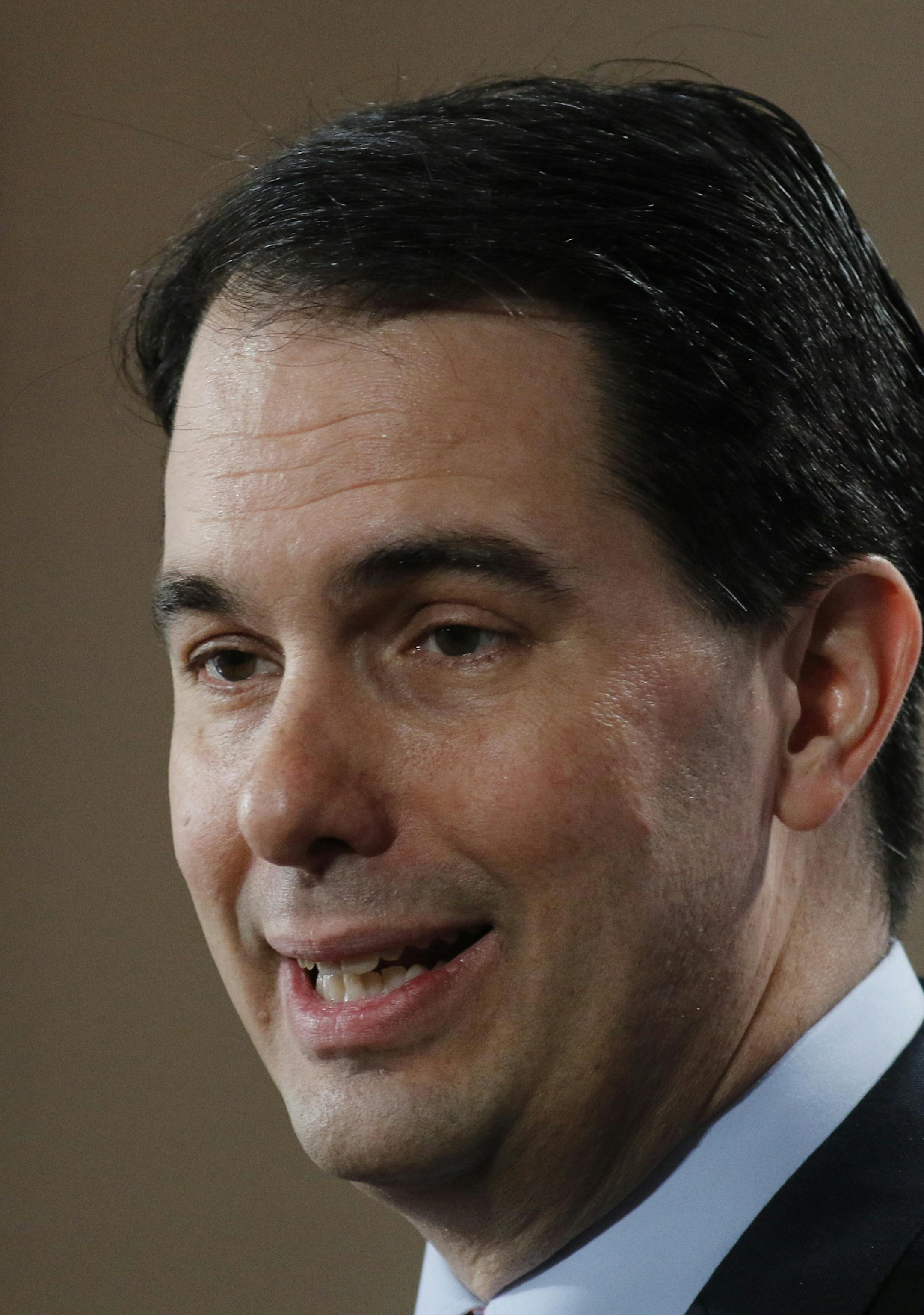 Wisconsin Gov. Scott Walker speaks at the winter meeting of the free market Club for Growth winter economic conference at the Breakers Hotel Saturday, Feb. 28, 2015, in Palm Beach, Fla. (AP Photo/Joe Skipper)