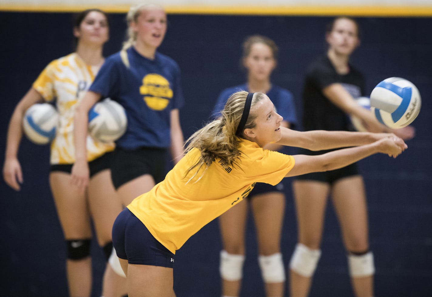 Prior Lake High School volleyball player CC McGraw digs the ball during a captain's practice. ] (Leila Navidi/Star Tribune) leila.navidi@startribune.com BACKGROUND INFORMATION: Prior Lake High School volleyball player CC McGraw, 16, photographed during a captain's practice at Prior Lake High School in Savage on Tuesday, August 9, 2016.