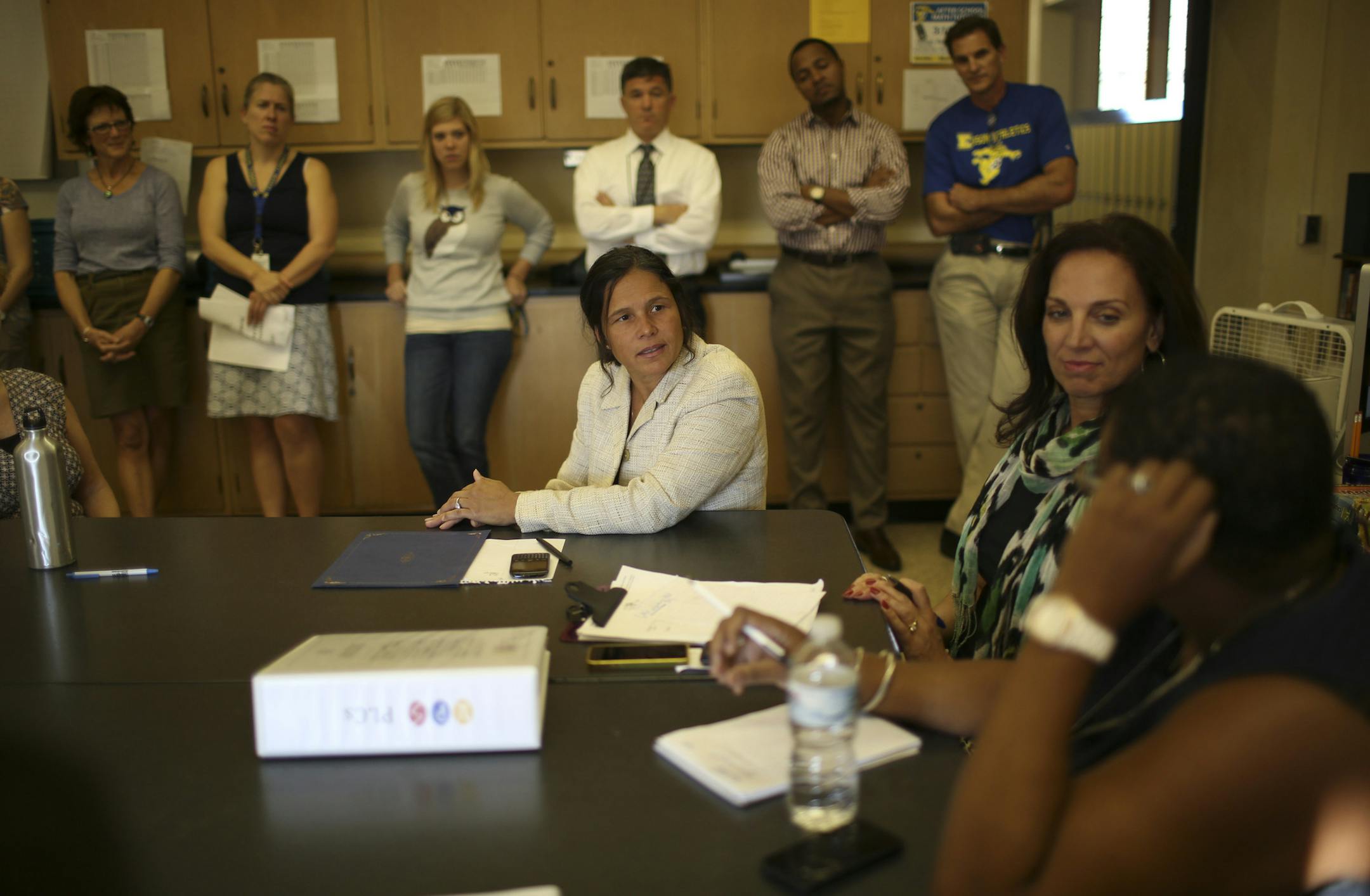 The state released school rankings based on its new accountability system which looks at proficiency, growth, achievement gap reduction and graduation rate. State Education Commissioner Brenda Cassellius visited Edison High School in Minneapolis Tuesday afternoon, October 1, 2013 to congratulate staff on the school's removal from the "priority" (worst) list in Multiple Measurements Rating. At a meeting of department heads and others at Edison High School, Education Commissioner Brenda Cassellius