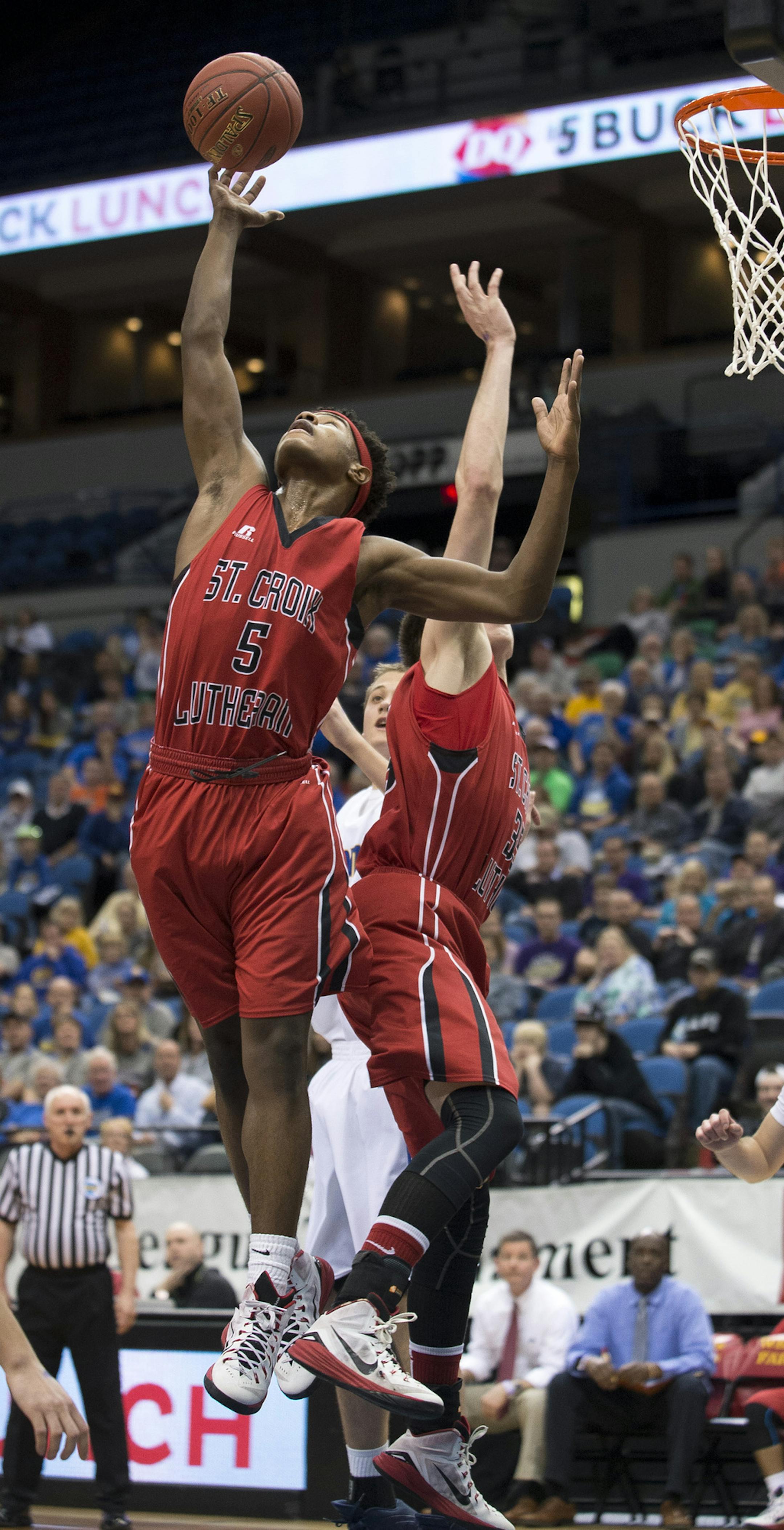 St. Croix Lutheran guard Ade Lamu (5) grabbed a defensive rebound off a shot by Esko in the first half. ] (Aaron Lavinsky | StarTribune) Esco plays St. Croix Lutheran in the Class 2A boys' basketball quarterfinals on Wednesday, March 11, 2015 at Target Center.