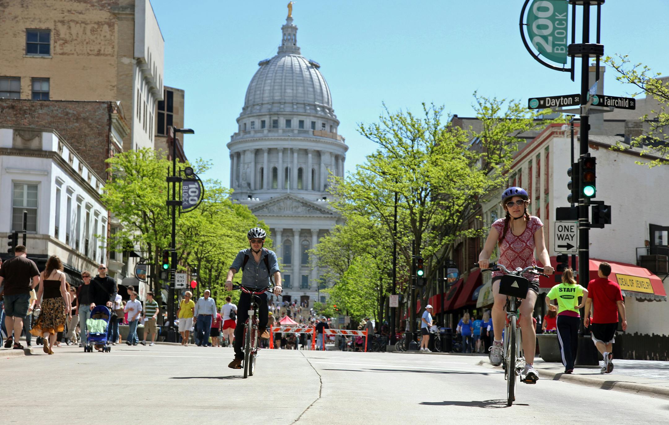 This undated image provided by the Greater Madison Convention & Visitors Bureau shows bicyclists on State Street in Madison, Wis. State Street runs about three-quarters of a mile from the state Capitol to the University of Wisconsin campus. The thoroughfare is car-free except for delivery trucks and buses, attracting a mix of undergrads, locals and government workers for shopping, dining and people-watching. (AP Photo/ Greater Madison Convention & Visitors Bureau, John Maniaci) ORG XMIT: NYET321