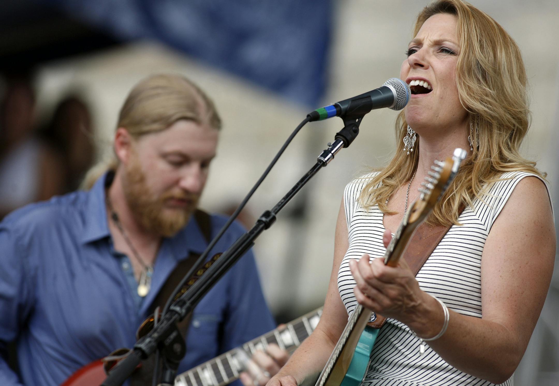 Susan Tedeschi and Derek Trucks perform with the Tedeschi Trucks Band at the Newport Jazz Festival in Newport, R.I. on Sunday, Aug. 5, 2012. (AP Photo/Joe Giblin) ORG XMIT: RIJG120
