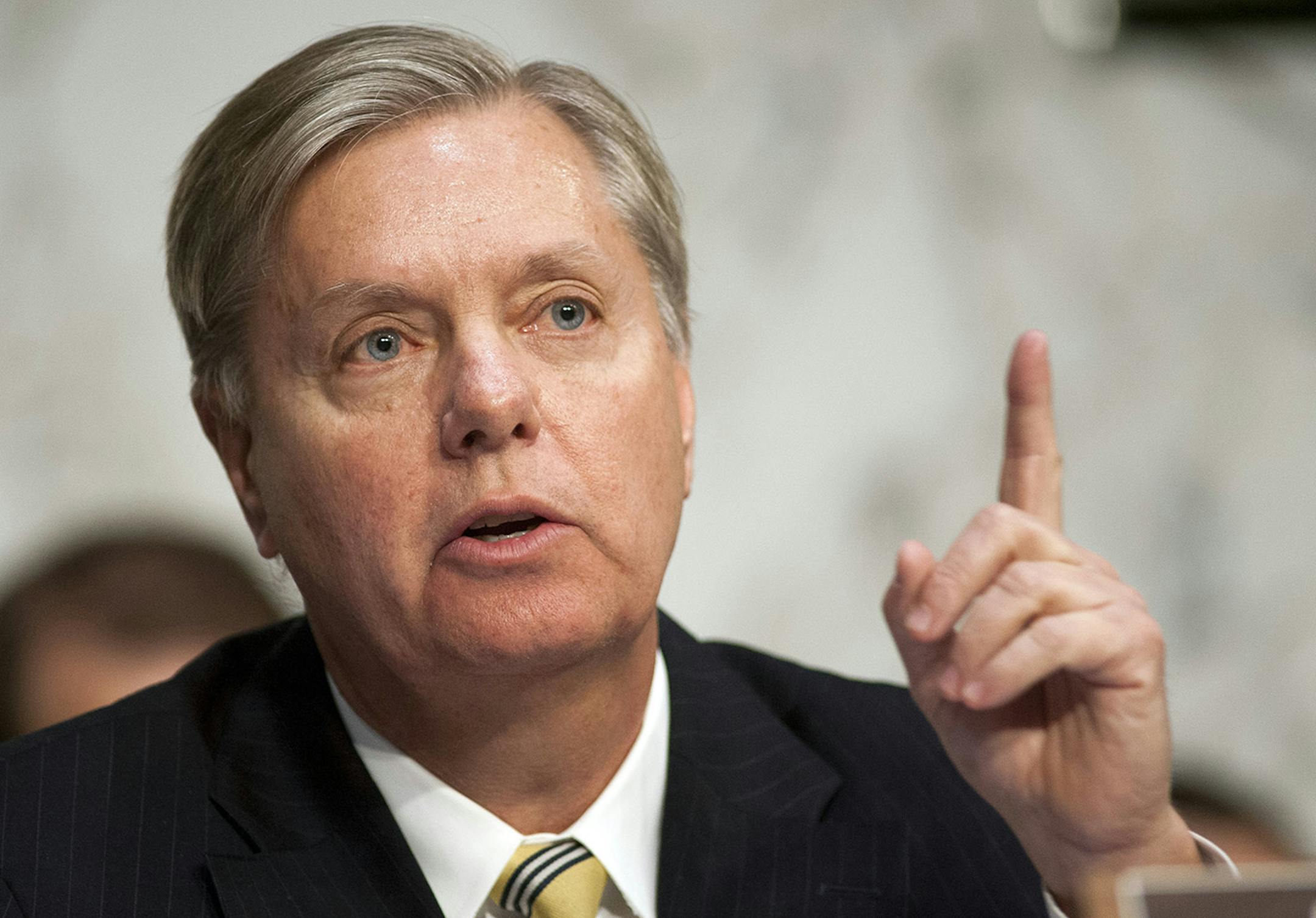Sen. Lindsey Graham, R-S.C., questions a witness during a hearing on the use of drones on Capitol Hill in Washington, Tuesday, April 23, 2013. Senate Democrats and Republicans challenged the Obama administration to explicitly spell out its justification for using drones for targeted killings amid growing concerns about unchecked powers of the presidency and Americans' civil liberties. (AP Photo/Cliff Owen) ORG XMIT: MIN2013051016084894