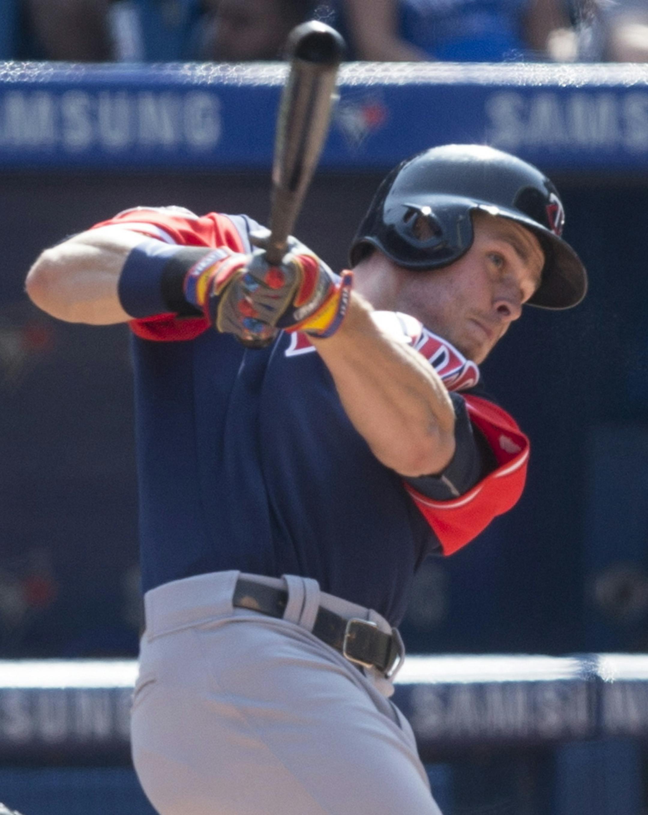 Minnesota Twins' Max Kepler, right, watches the flight of the ball as he hits a grand slam as Toronto Blue Jays catcher Raffy Lopez looks on during eighth inning American League MLB baseball action in Toronto on Saturday, Aug. 26 2017. (Chris Young/The Canadian Press via AP)