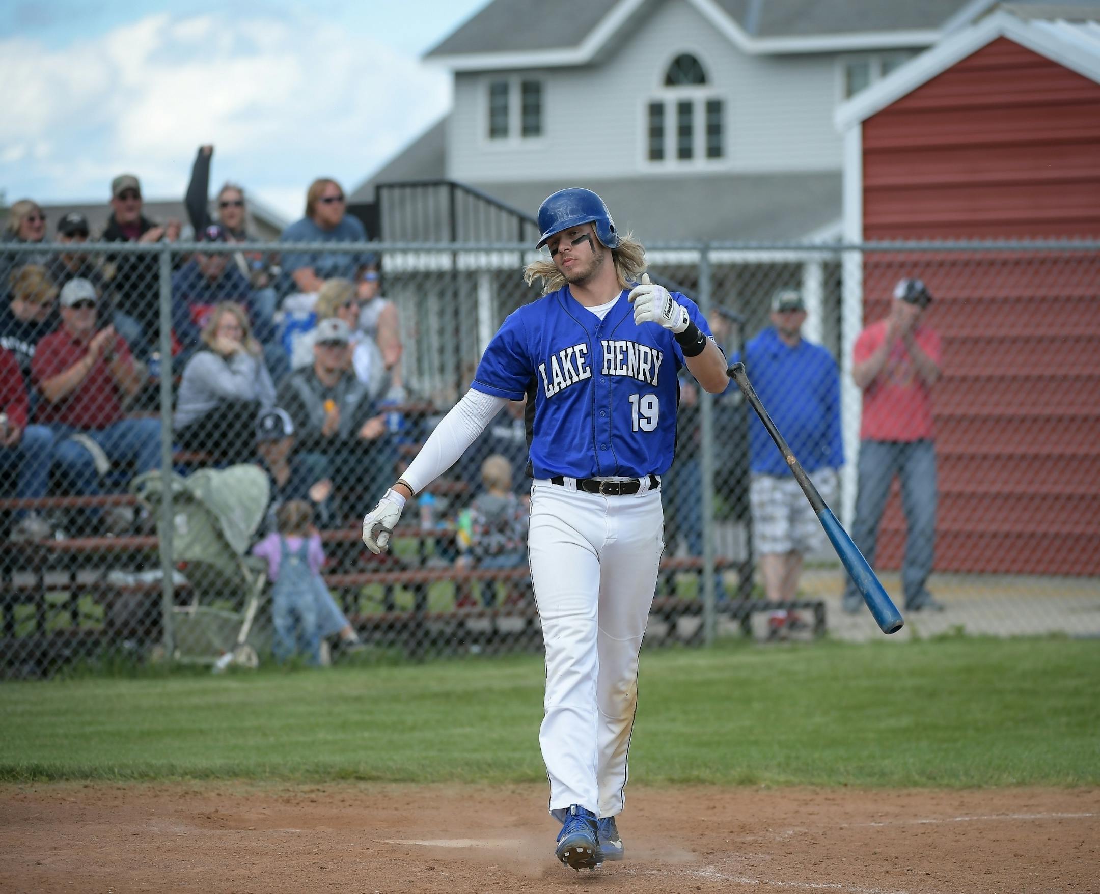 Lake Henry's Matt Quade flipped his bat after striking out to end his team's game against Richmond on Sunday, June 25, 2017 in Lake Henry. Richmond beat Lake Henry 11-8.