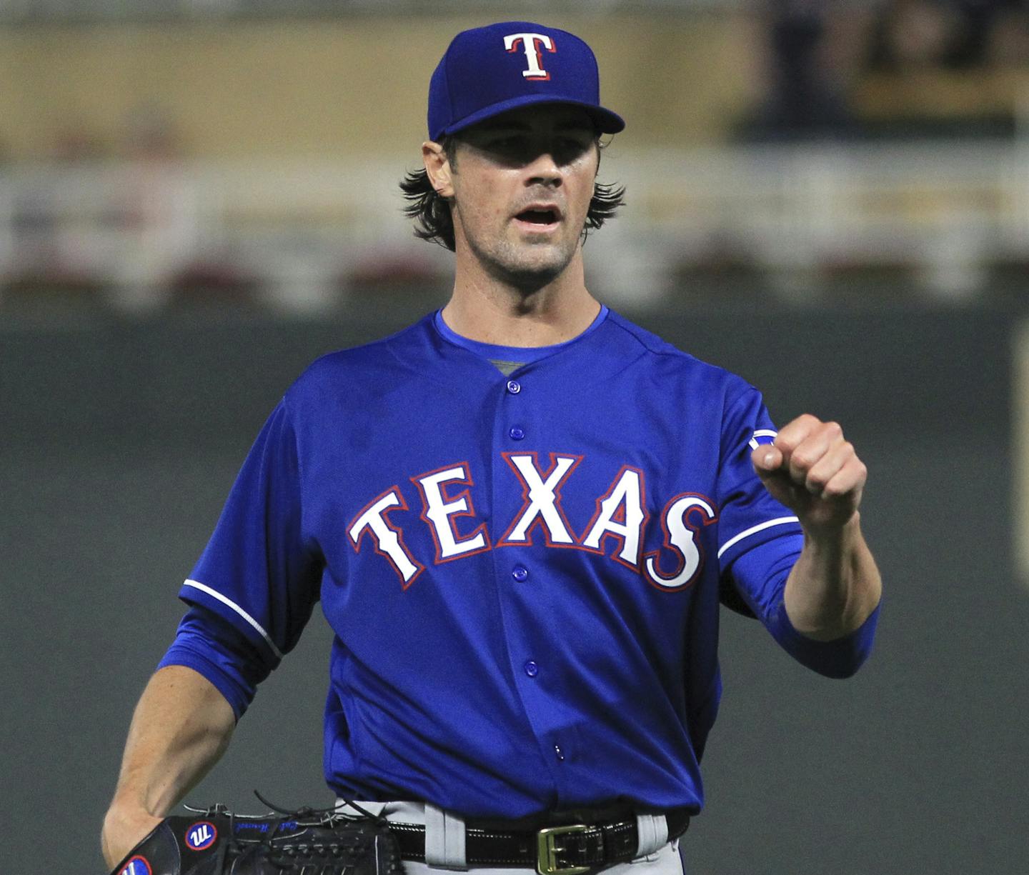 Texas Rangers pitcher Cole Hamels (35) celebrates with catcher Robinson Chirinos (61) after the Rangers defeated the Minnesota Twins during a baseball game Saturday, Aug. 5, 2017, in Minneapolis. The Rangers won 4-1. (AP Photo/Andy Clayton-King)