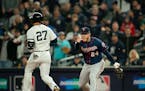 Twins first baseman C.J. Cron pointed to third baseman Miguel Sano after he fielded a grounder by Yankees left fielder Giancarlo Stanton in Game 1 of 