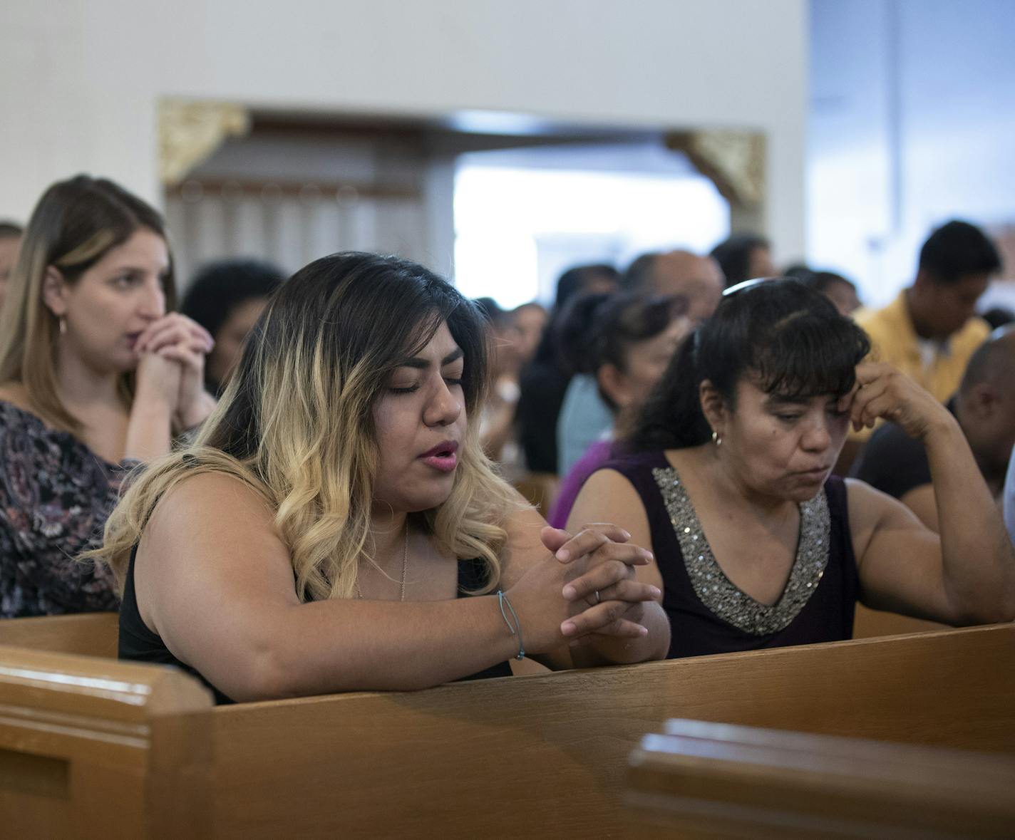 Parishioners prayed at Our Lady of Guadalupe Church prayed for the people who were shot and killed yesterday by a gunman in El Paso Texas Sunday August 4, 2019 in St. Paul, MN.] Jerry Holt &#x2022; Jerry.holt@startribune.com