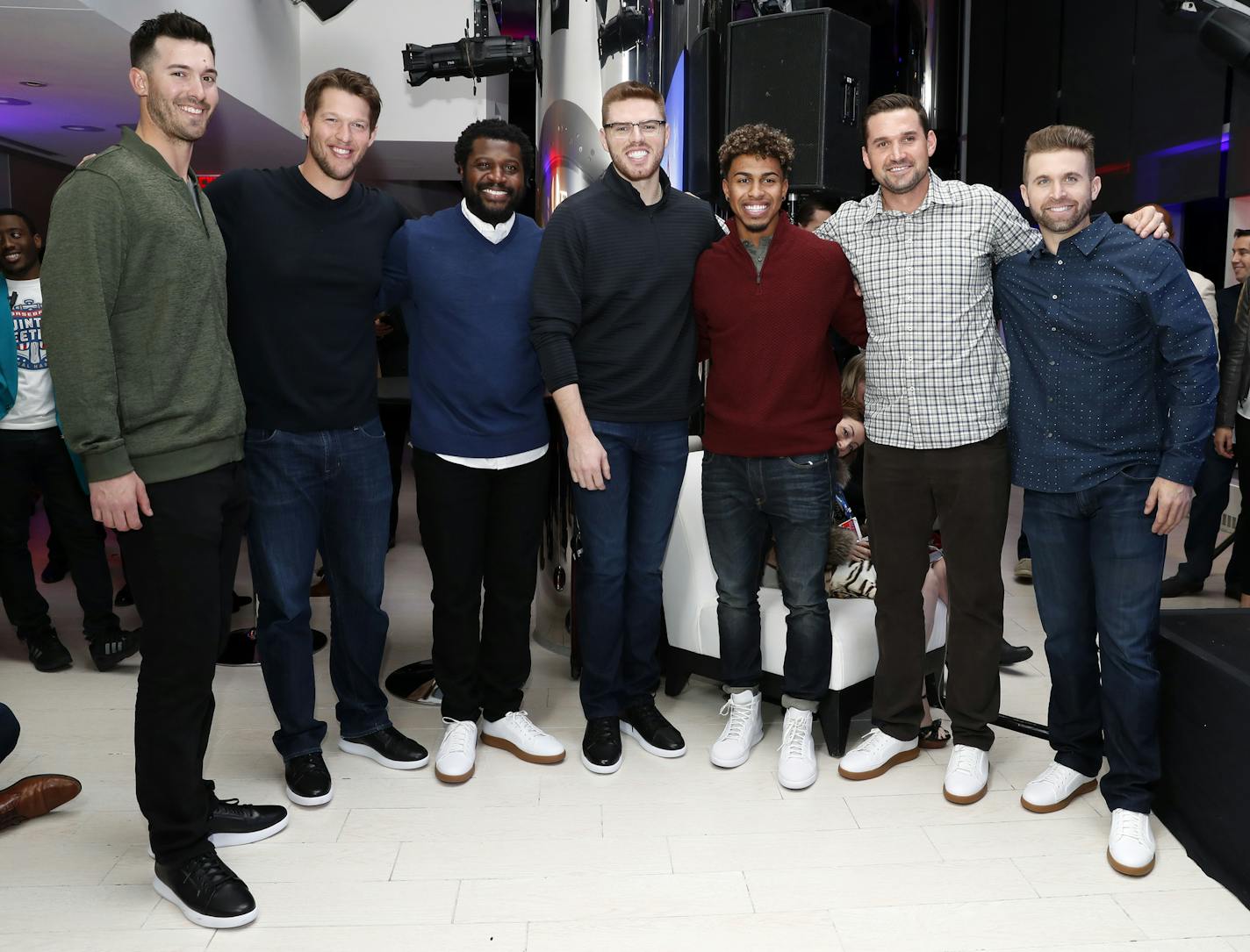 Boston Red Sox' Rick Porcello, left, Los Angeles Dodgers' Clayton Kershaw, Cincinnati Reds' Brandon Phillips, Atlanta Braves' Freddie Freeman, Cleveland Indians' Francisco Lindor, Washington Nationals' Ryan Zimmerman, and Minnesota Twins Brian Dozier, pose for photographers during an Under Armour announcement event at Major League Baseball's winter meetings, Monday, Dec. 5, 2016 in Oxon Hill, Md. Under Armour will take over as the supplier of Major League Baseball uniforms in 2020. (AP Photo/Ale