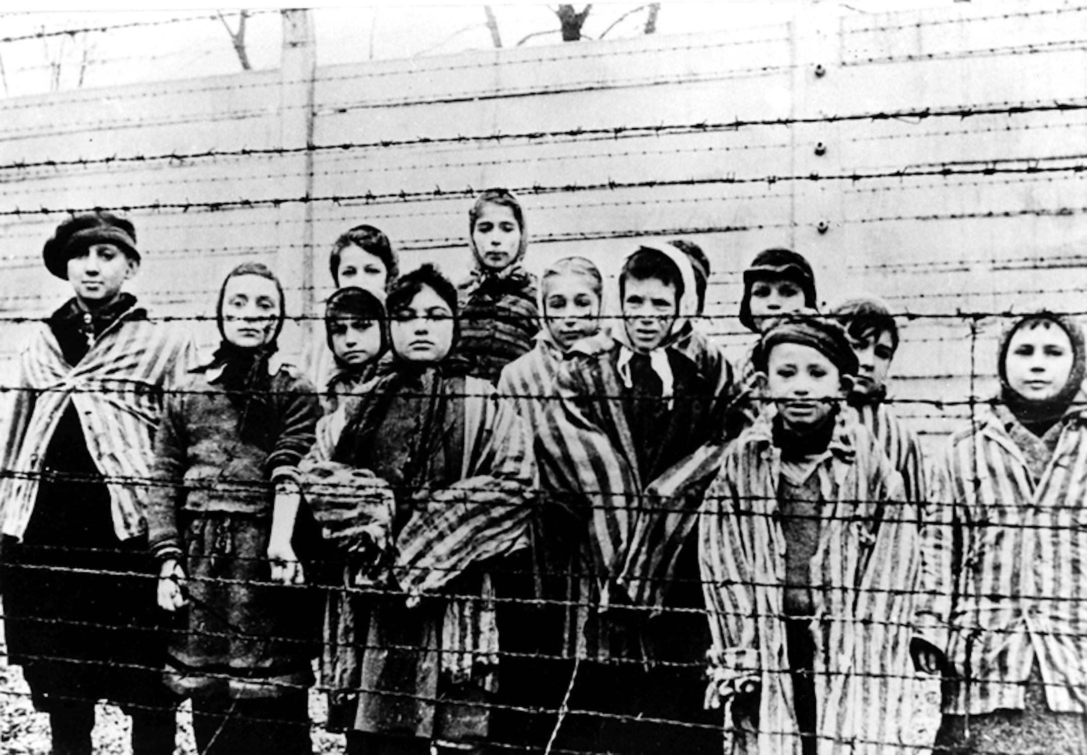 A picture taken just after the liberation by the Soviet army in January, 1945, shows a group of children wearing concentration camp uniforms including Martha Weiss who was ten years-old, 6th from right, at the time behind barbed wire fencing in the Oswiecim (Auschwitz) nazi concentration camp.