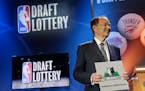 Minnesota Timberwolves owner Glen Taylor poses for photos after the Timberwolves won the No. 1 pick in the NBA basketball draft lottery Tuesday in New