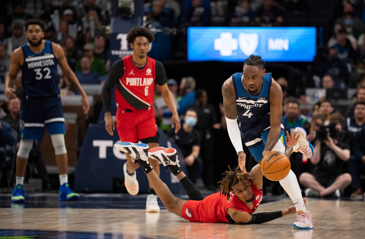 Minnesota Timberwolves guard Jaylen Nowell (4) gained control of a loose ball that eluded Portland Trail Blazers forward Greg Brown III (4) in the first quarter of an NBA basketball game Monday night, March 7, 2022 at Target Center in Minneapolis, Minn. The Minnesota Timberwolves faced the Portland Trailblazers. ] JEFF WHEELER • Jeff.Wheeler@startribune.com