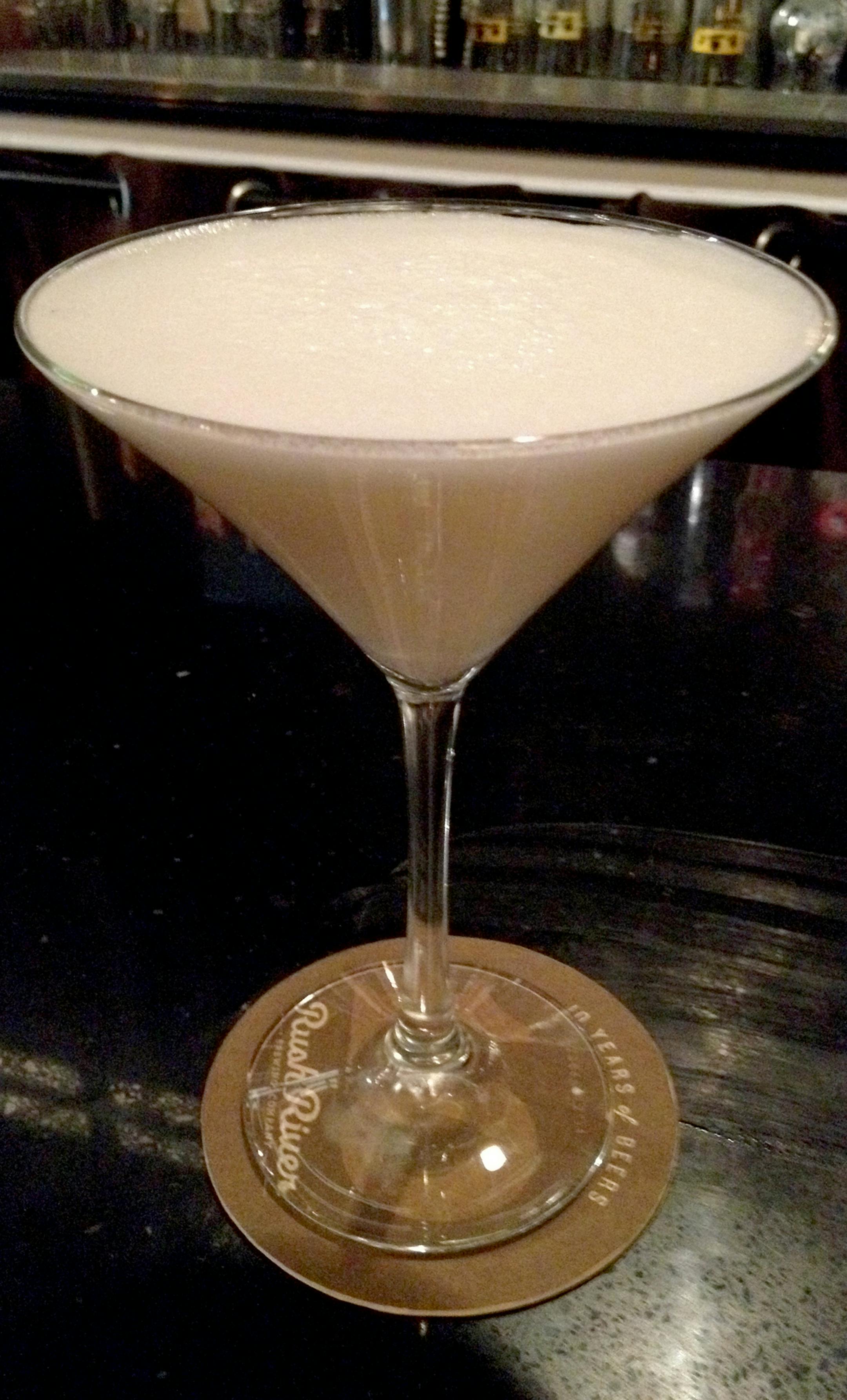 The frothy martini glass cocktail is the Rabbit Hole's Flying Ramos