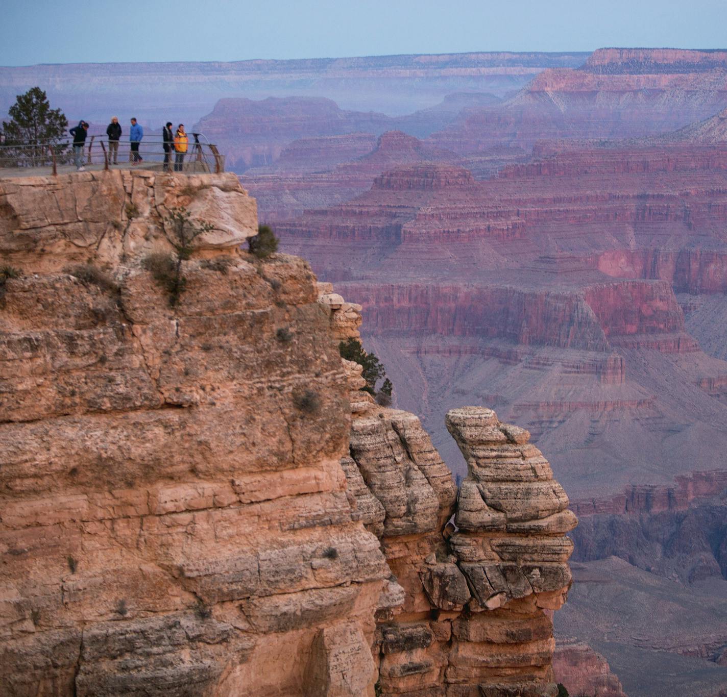Sightseers on the South Rim of the Grand Canyon near Tusayan, Ariz. The national landmark draws 4.5 million people a year, including the author’s “Richaca” family of Minnetonka.