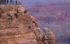 Sightseers on the South Rim of the Grand Canyon near Tusayan, Ariz. The national landmark draws 4.5 million people a year, including the author&#x2019