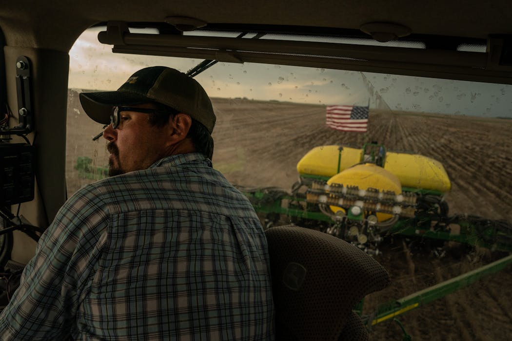 A farmer planted fields with sorghum in Scott City, Kan. Groundwater loss is hurting breadbasket states such as Kansas, where the major aquifer beneath 2.6 million acres of land can no longer support industrial-scale agriculture.