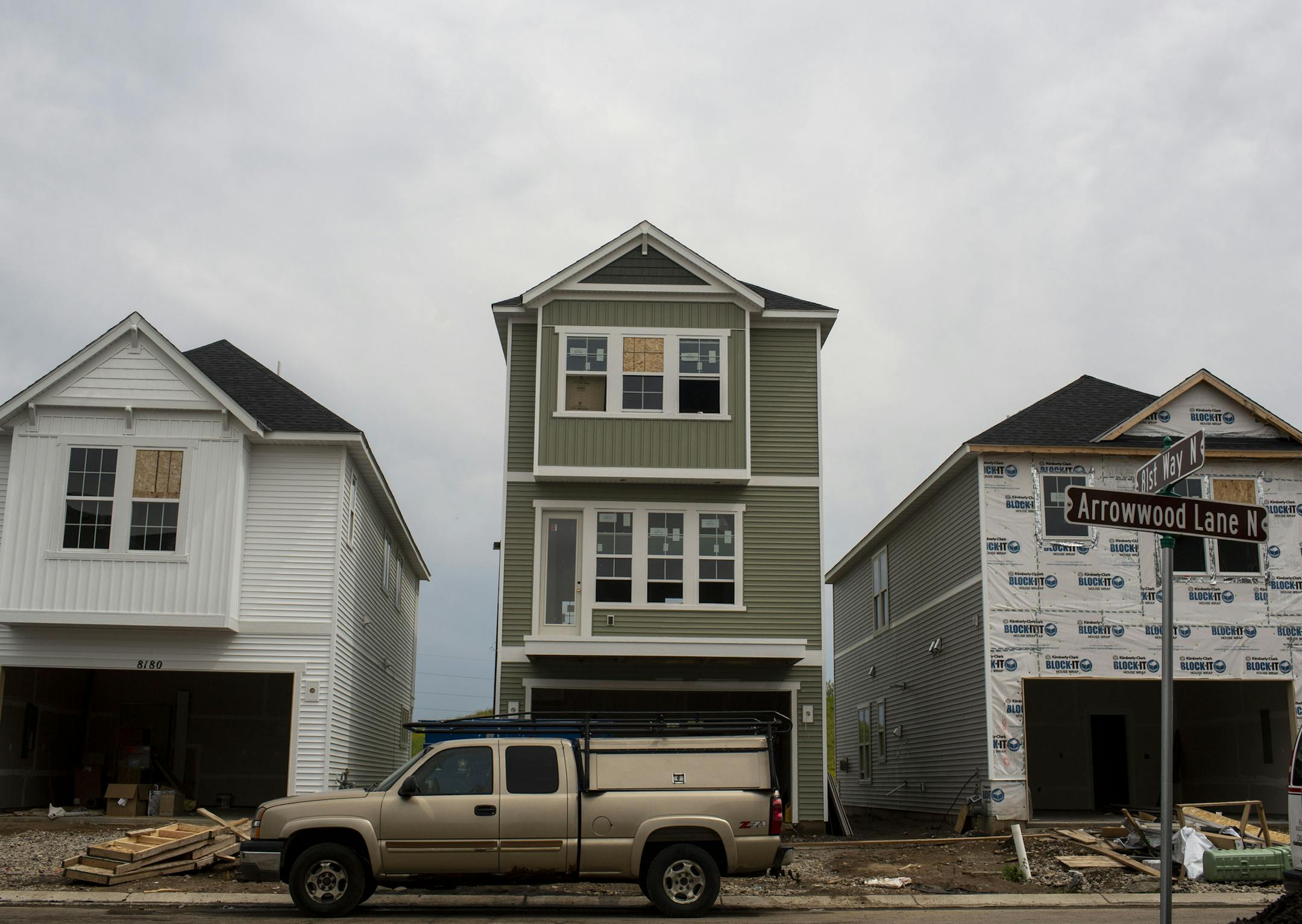Homes in various stages of building sit next to each other. ] NICOLE NERI • nicole.neri@startribune.com BACKGROUND INFORMATION: Construction crews work on building homes in the Donegal neighborhood Thursday, June 27, 2019.