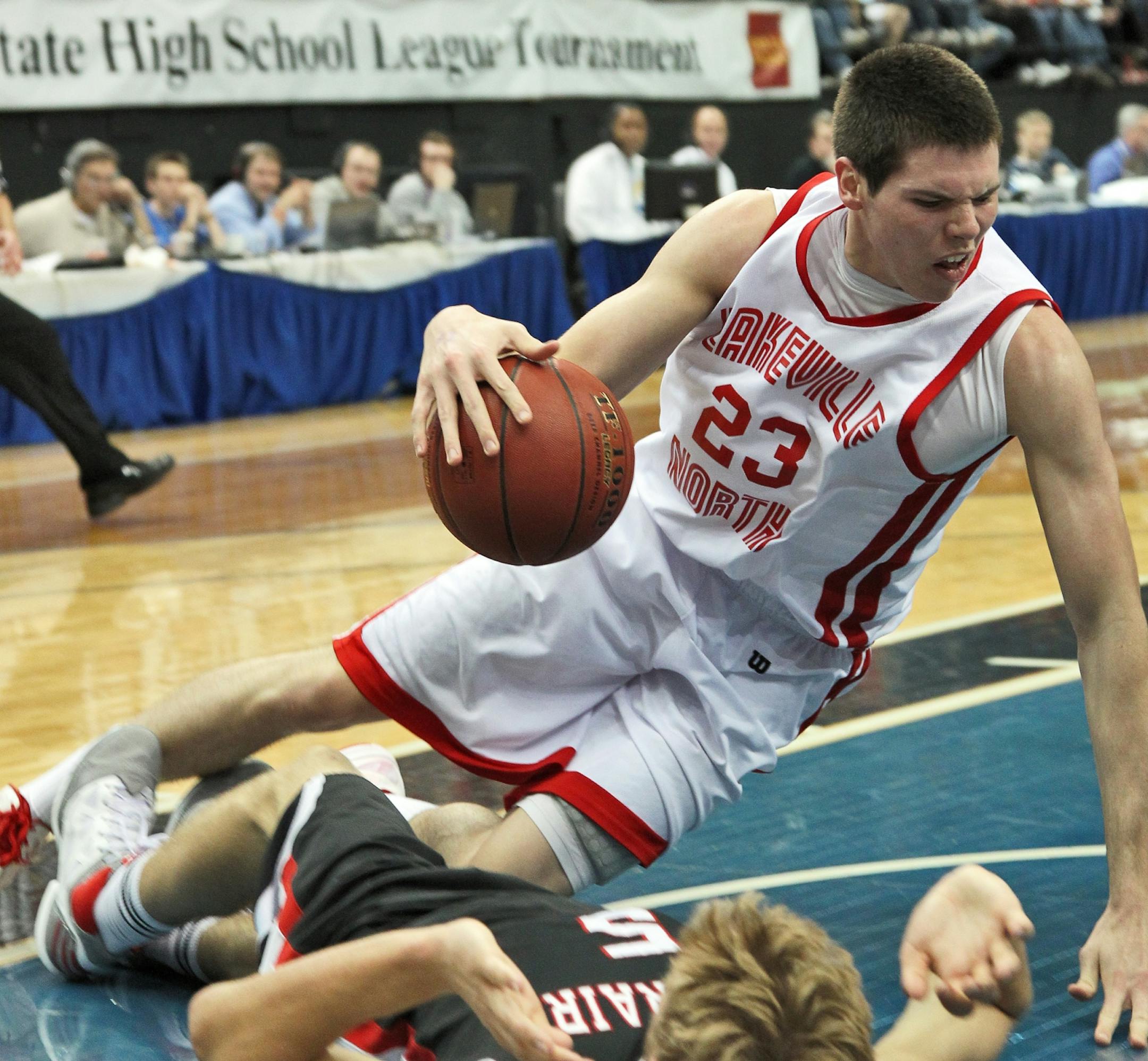 Lakeville North's Tyler Flack went to the floor with Eden Prairie's Sander Mohn as Flack drove to the basket.