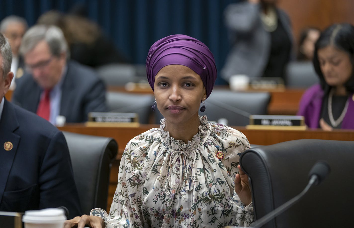 Rep. Ilhan Omar, D-Minn., sits with fellow Democrats on the House Education and Labor Committee during a bill markup, on Capitol Hill in Washington, Wednesday, March 6, 2019. Omar stirred controversy last week saying that Israel's supporters are pushing U.S. lawmakers to take a pledge of "allegiance to a foreign country." Omar is not apologizing for that remark, and progressives are supporting her. (AP Photo/J. Scott Applewhite)