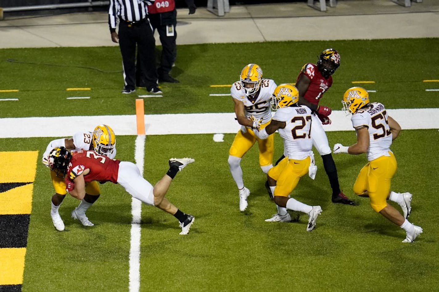 Maryland running back Jake Funk dives in for a touchdown against Minnesota defensive back Jordan Howden during the second half.