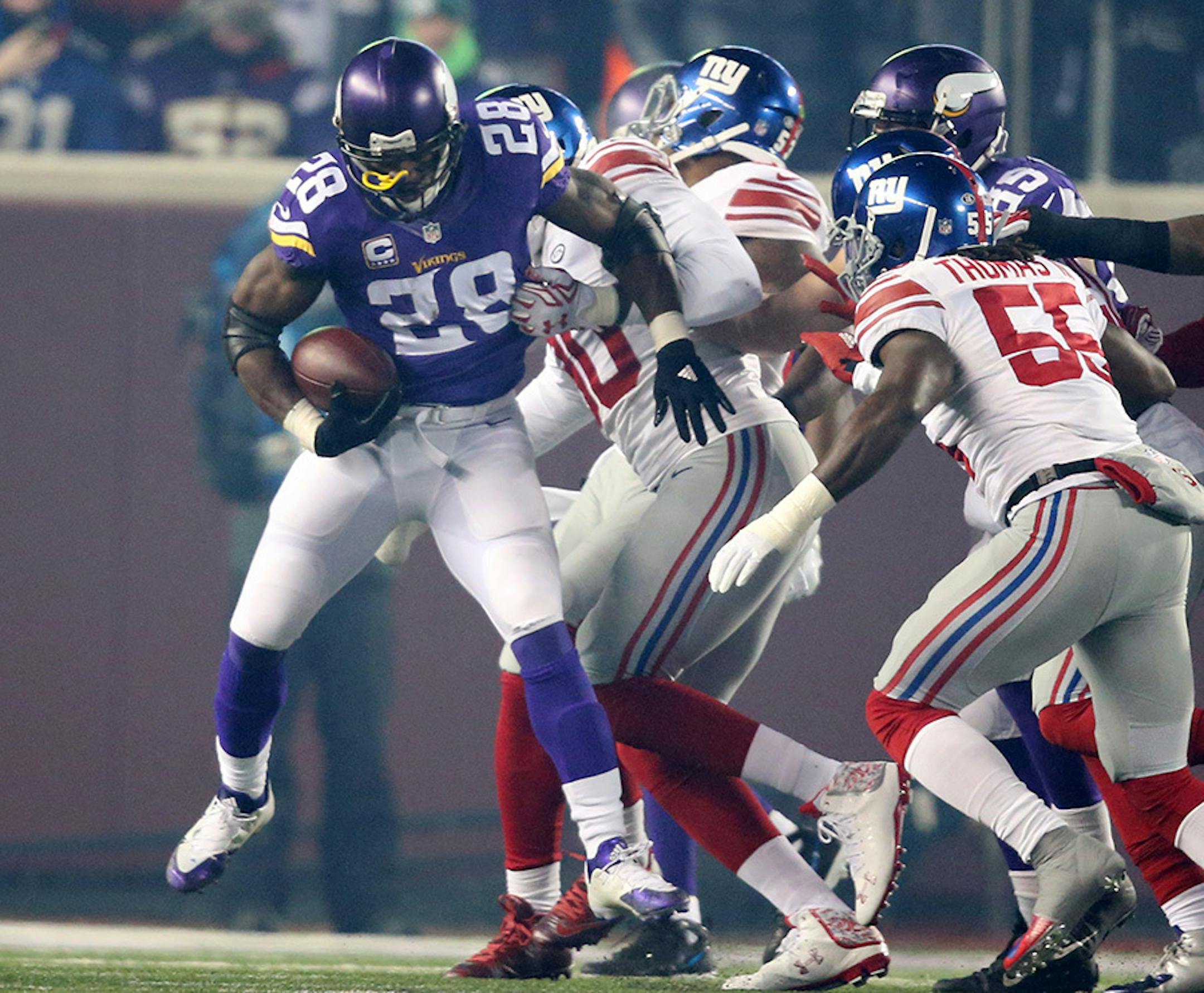 Minnesota Vikings running back Adrian Peterson (28) is stopped for no gain by the Giants defense in the first quarter Sunday December 27, 2015 in Minneapolis, MN.