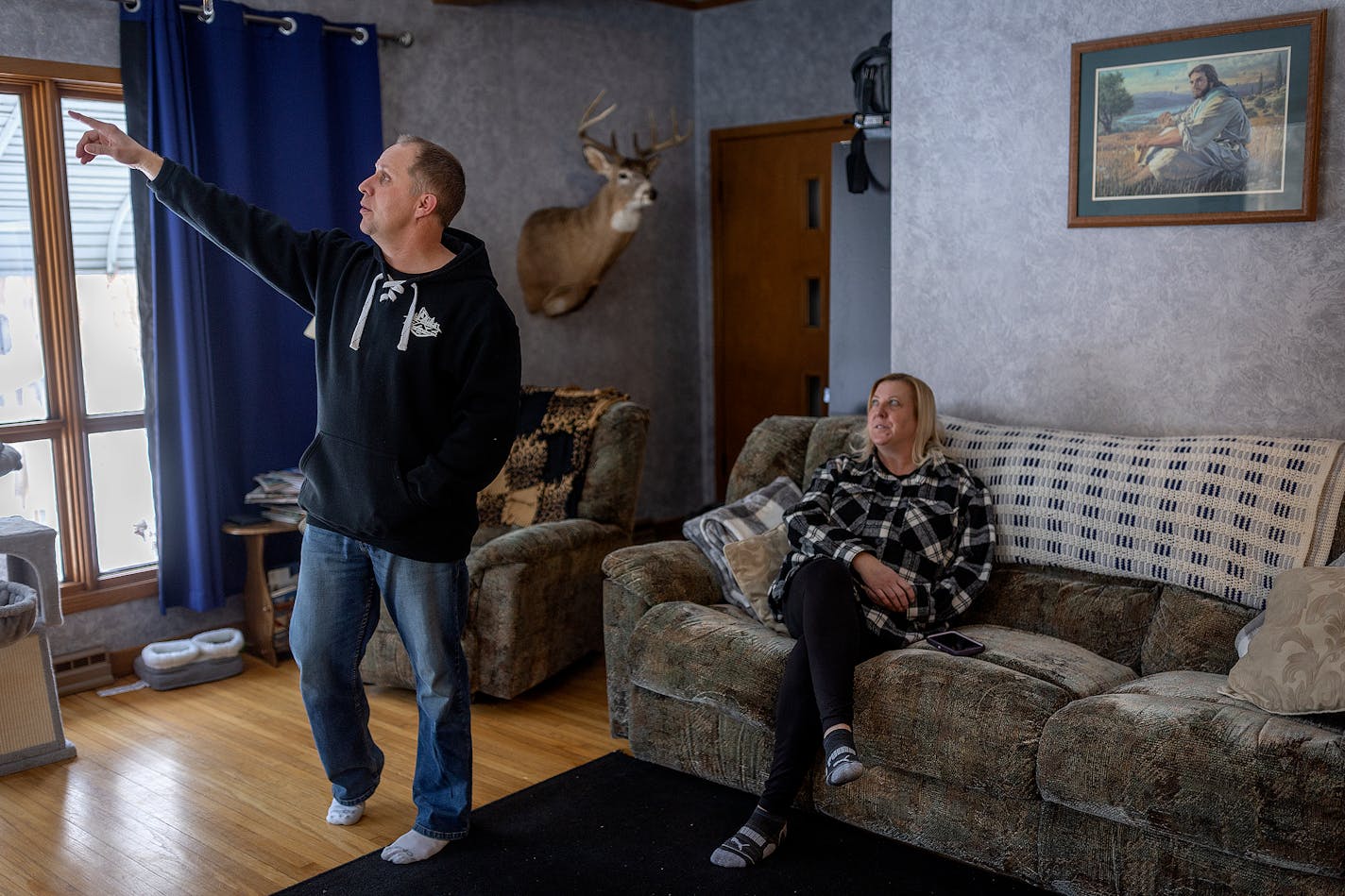 Pat Schultz, left, and his wife Tracy, show cracks in their house they believe were made by reefer trailers at the Long Prairie Packing Company in Long Prairie, Minn., on Tuesday, Jan. 16, 2024. Their house, built in 1917, is across the street from the beef slaughterhouse. ] Elizabeth Flores • liz.flores@startribune.com