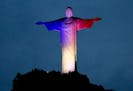 Christ the Redeemer statue is lit with the colors of France's flag, in solidarity with France after attacks in Paris, in Rio de Janeiro, Brazil, Satur