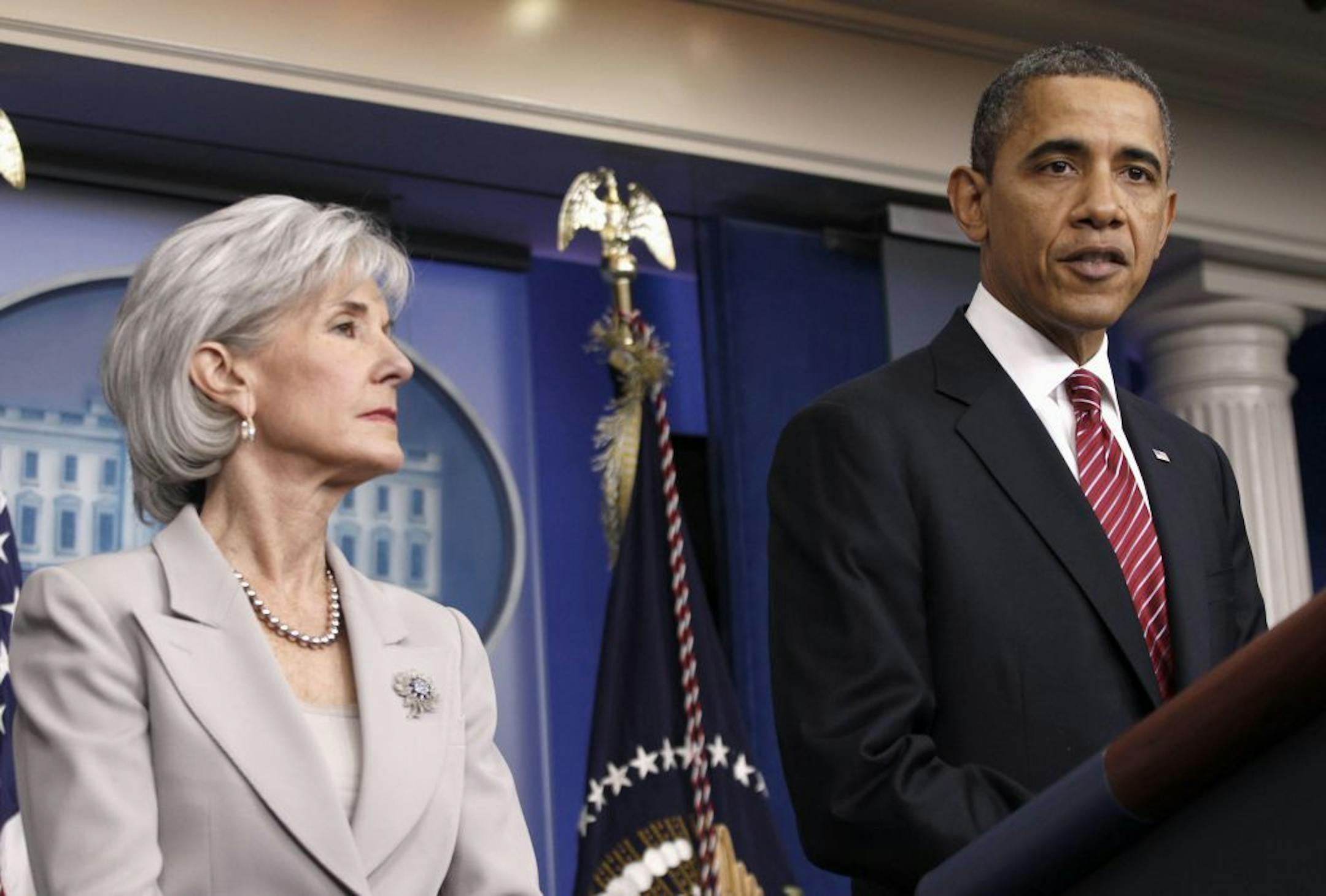 President Barack Obama, accompanied by Health and Human Services Secretary Kathleen Sebelius announces the revamp of his contraception policy requiring religious institutions to fully pay for birth control, Friday, Feb. 10, 2012, in the Brady Press Briefing Room of the White House in Washington.