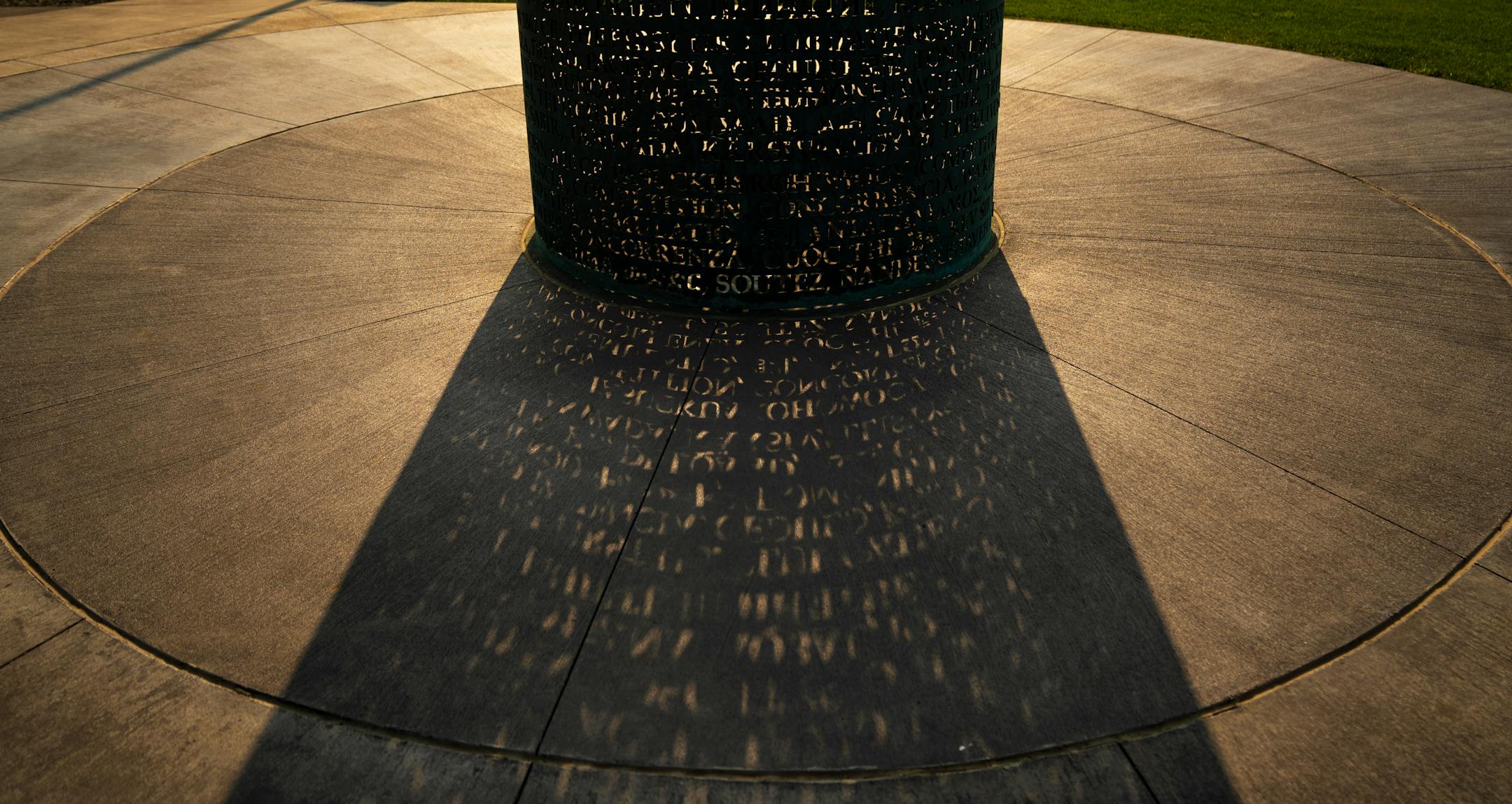 The OMNIS sculpture outside Allianz Stadium in the evening sun before a game with Everton, Wednesday, July 20, 2022, St. Paul, Minn. The OMNIS sculpture by artist Jim Sanborn is located at the north side of Allianz Stadium. It is a cylindrical bronze work with text about the values of soccer written in 80 or so languages; at night, the sculpture lights up from the inside and projects text onto the ground and nearby buildings. The piece was commissioned by Bill McGuire, owner of Minnesota United and former CEO of UnitedHealthcare. ] GLEN STUBBE • glen.stubbe@startribune.com