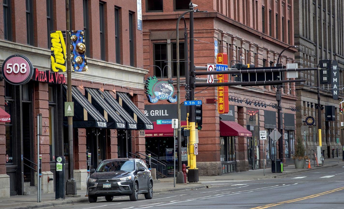 Bars on 1st Avenue in downtown Minneapolis that would normally be busy during happy hour on St. Patrick's Day were quiet on Tuesday after a state order that closed bars and restaurants.