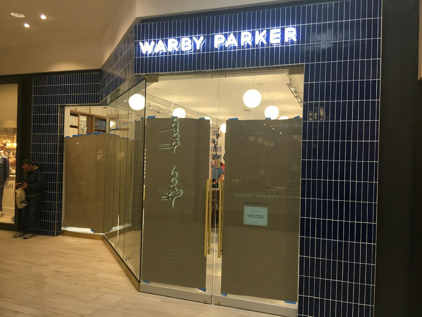 The windows at the new Warby Parker store at the Galleria were covered up ahead of Saturday's opening.