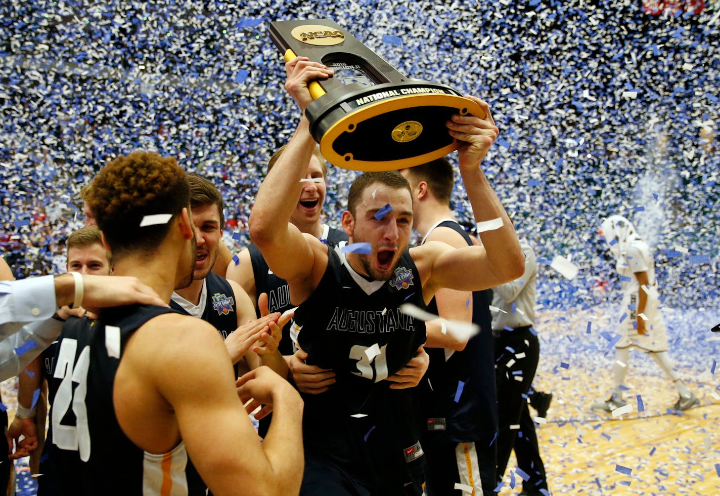 Alex Richter (31) and his Augustana (S.D.) teammates celebrated after defeating Lincoln Memorial 90-81 in the NCAA Division II championship basketball game in Frisco, Texas, in 2016. The school's path to Division I status suffered a setback after the Summit League denied their application to join in late May.