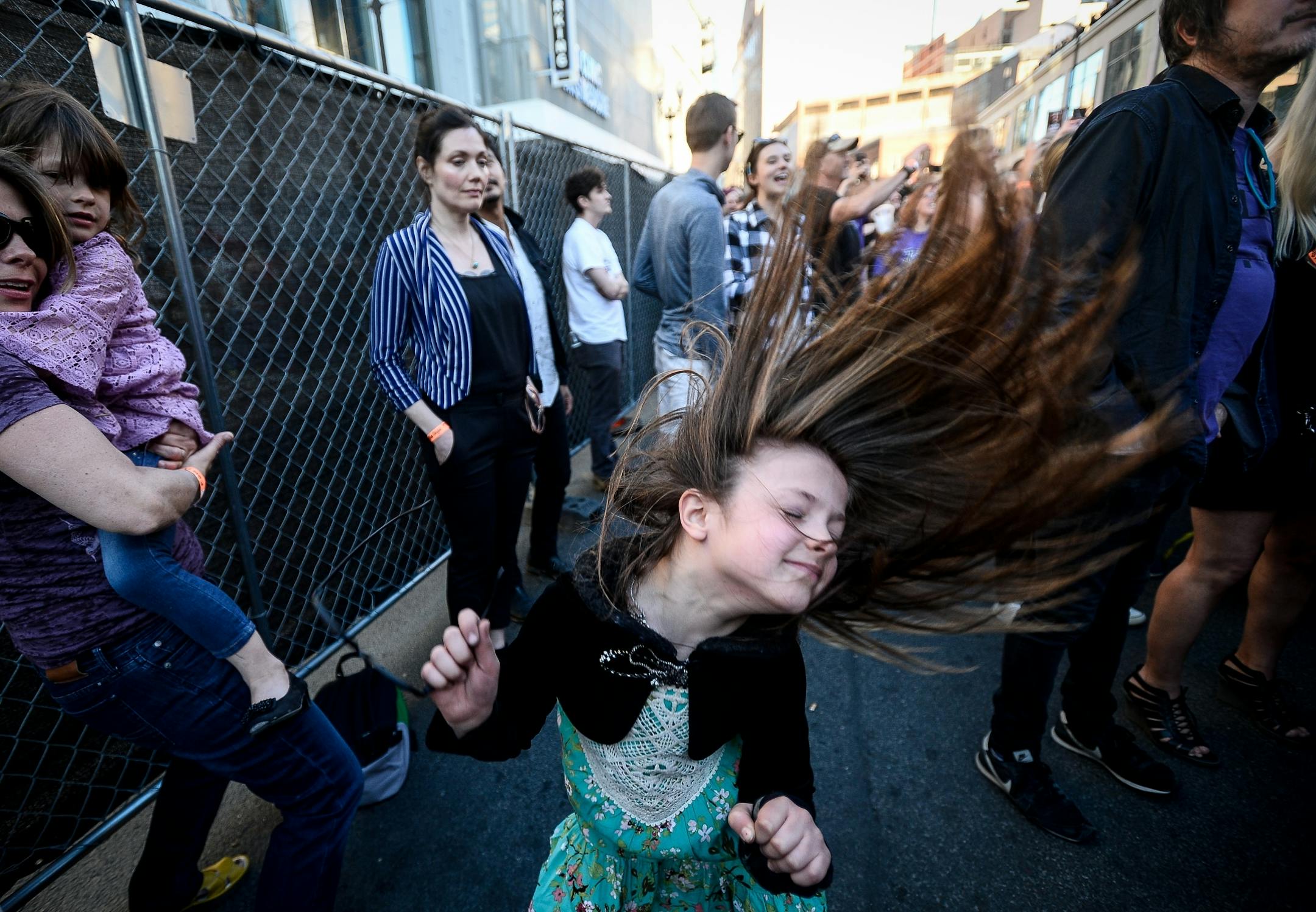 Etta Pennington, 6, of Minneapolis, whipped her hair around as she danced to music at First Ave's Prince memorial block party Saturday.