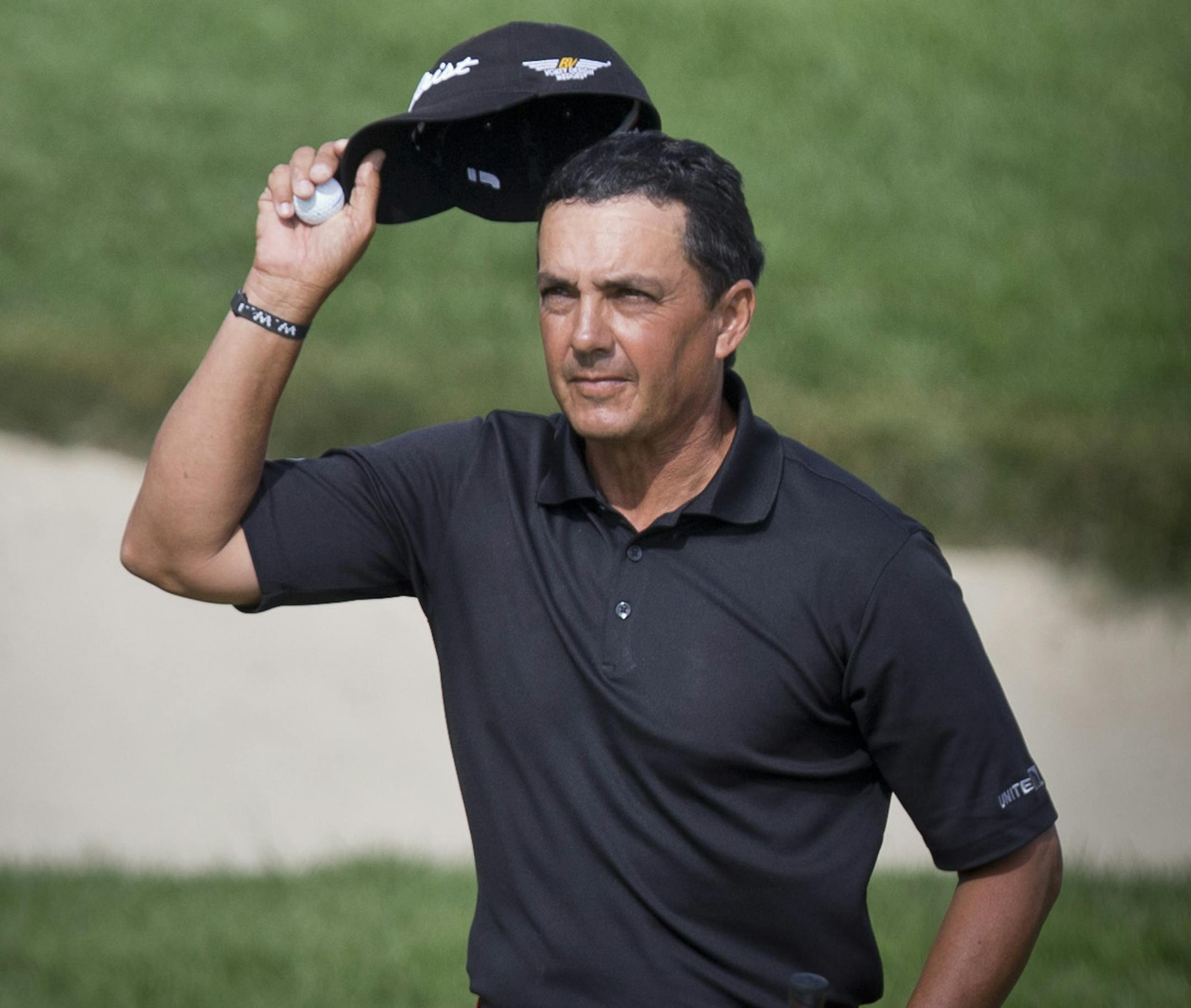 Tom Pernice Jr. tipped his hat to the crowd as he won the 3M Championship with a birdie on the 18th hole. on Sunday, August 4, 2013, at TPC of the Twin Cities golf course in Blaine.