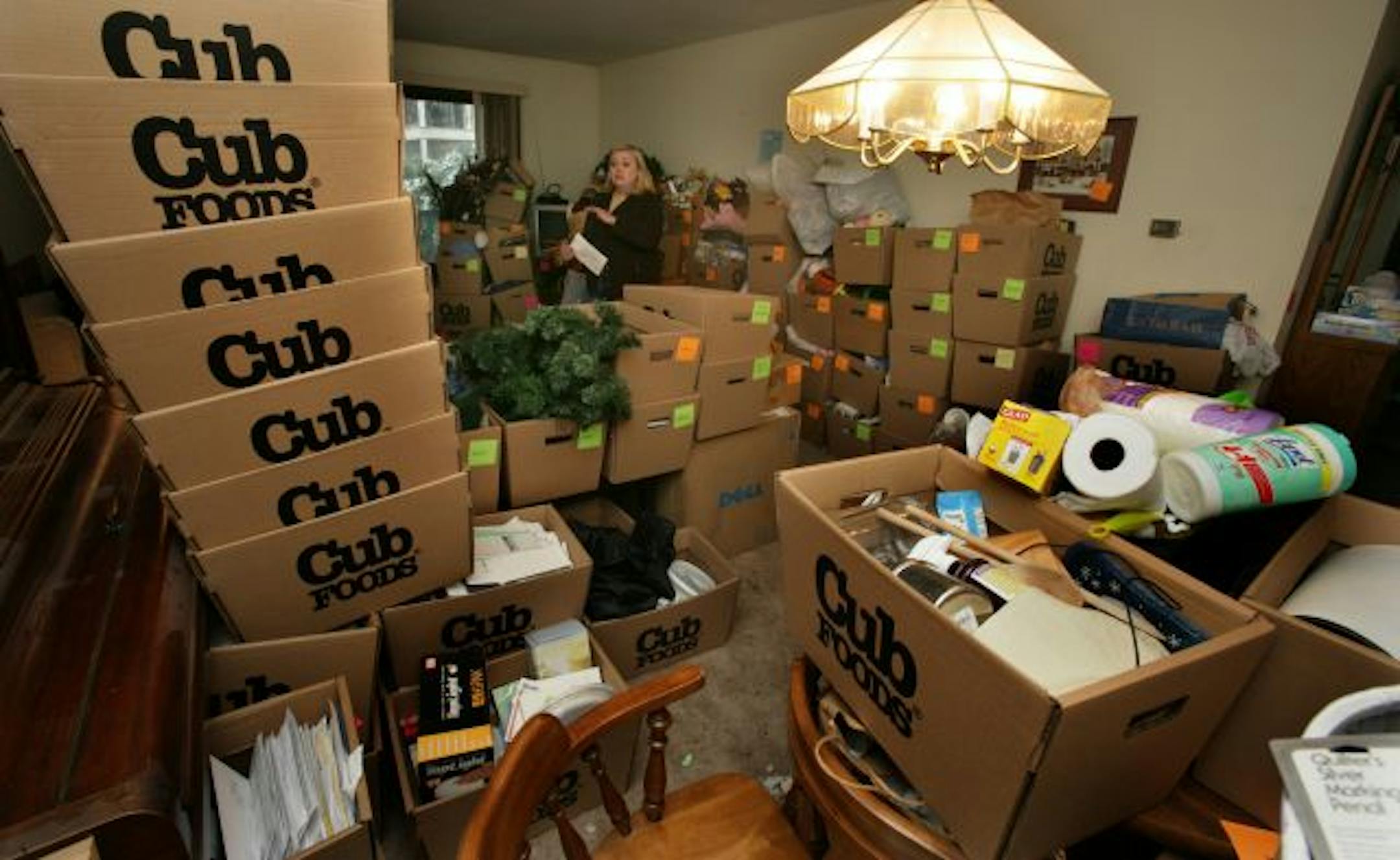 Nikki Havens sorted Jeanne Leier's belongings into several Cub boxes marking them with colored tags.