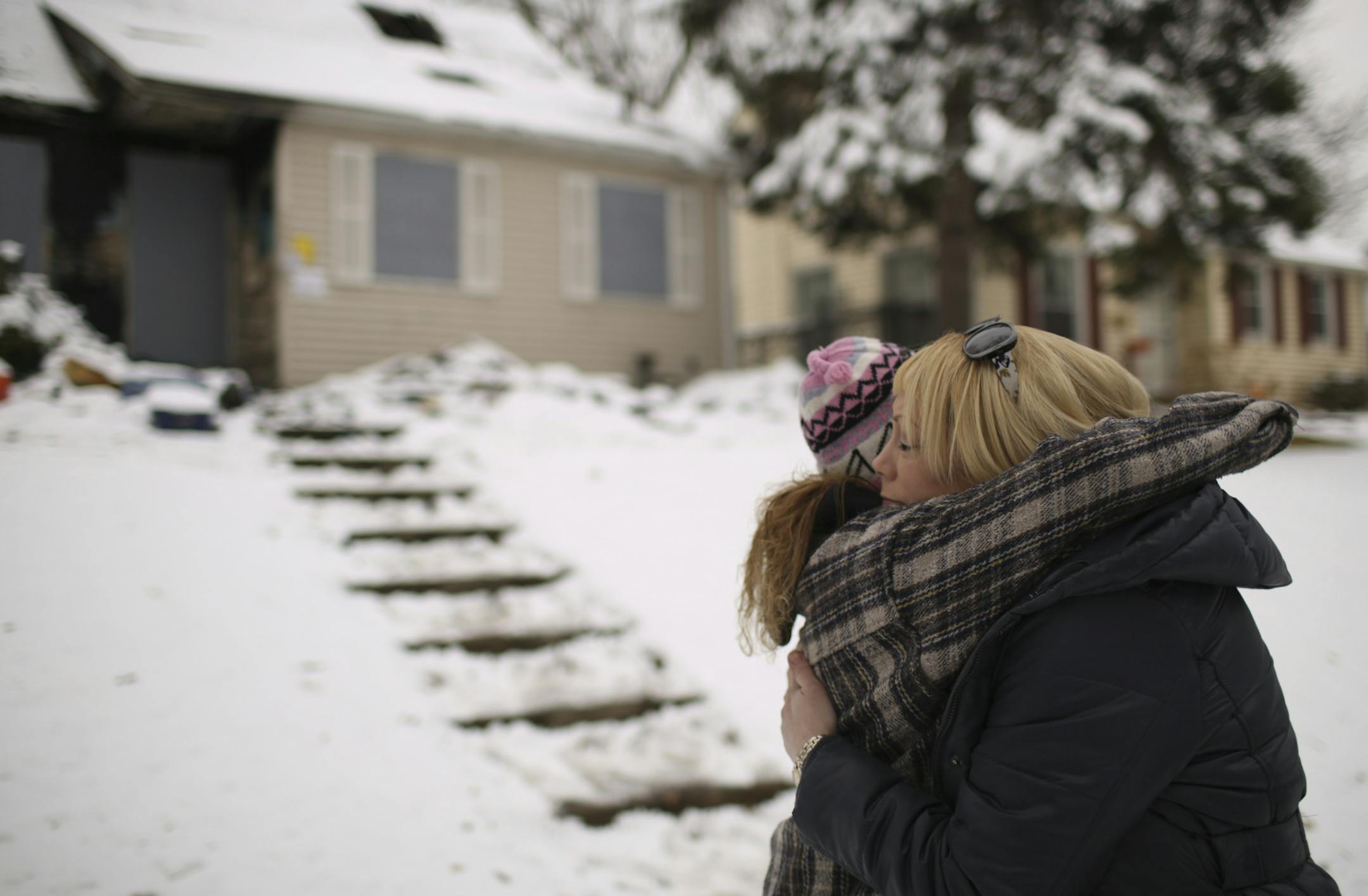 Tammy Olson was embraced by Tina Franco-Kvalevog, left, after she arrived at Renee Tollas' house Monday afternoon in St. Paul. The three work together at a Home Depot and Olson came right after her shift at the store. Tollas trained Olson and she said she was a beloved mentor to her. ] JEFF WHEELER ï jeff.wheeler@startribune.com Co-workers of Renee Tollas, 63, were drawn to her home on Rose Ave E. in St. Paul Monday afternoon as news of her death got around. Tollas was killed in a house fir