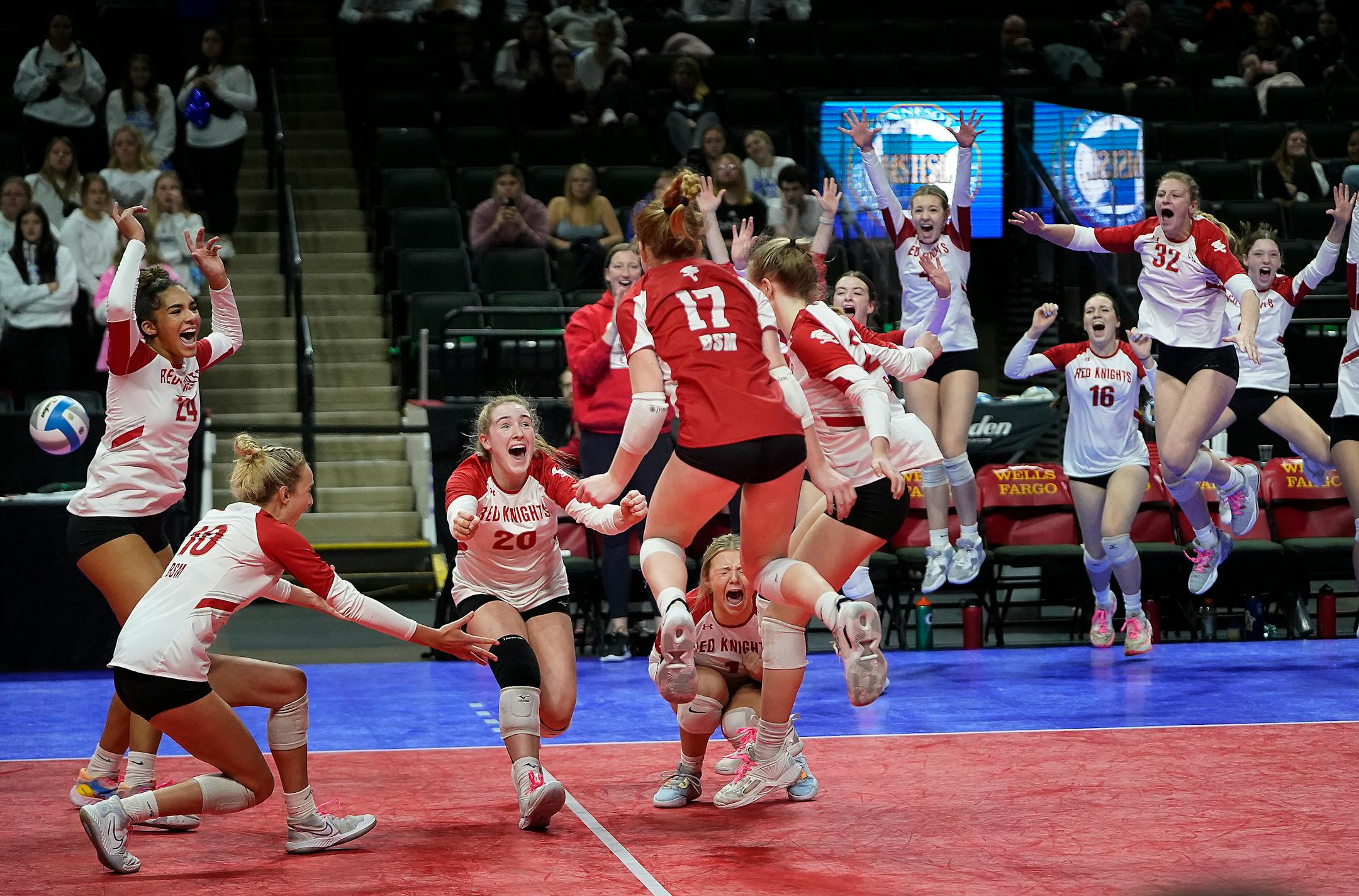 Benilde-St. Margaret's players celebrate their 3 games to none win over Kasson-Mantorville during Class 3A volleyball semifinals Friday, Nov. 11, 2022 at Xcel Energy Center in St. Paul, Minn.